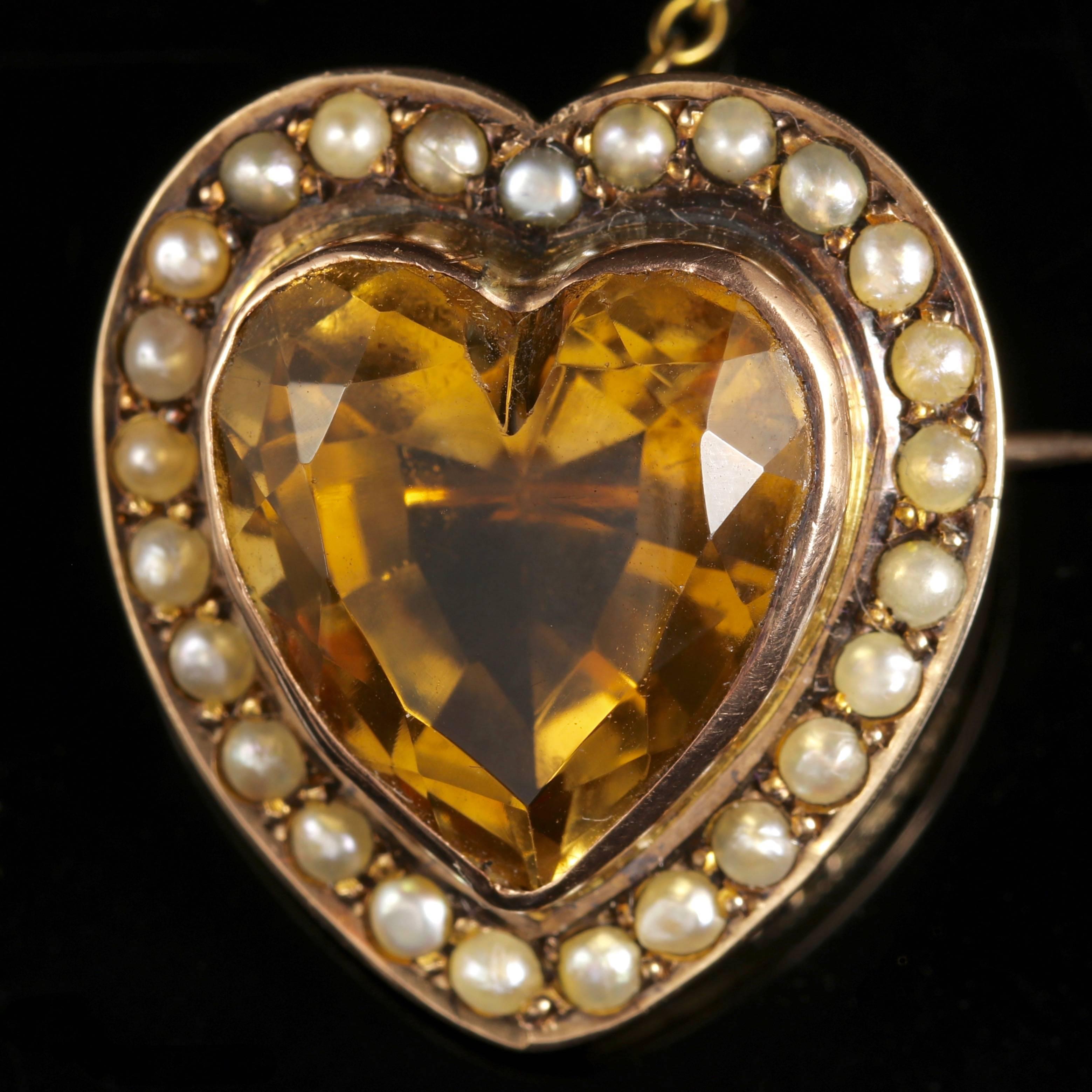 This genuine Victorian 15ct Yellow Gold heart brooch is set with a lovely rich Citrine and Pearls.

Circa 1880. 

The Citrine is hand cut into a heart, beautifully polished and surrounded by a halo of Pearls.

The central heart is over 10ct in size