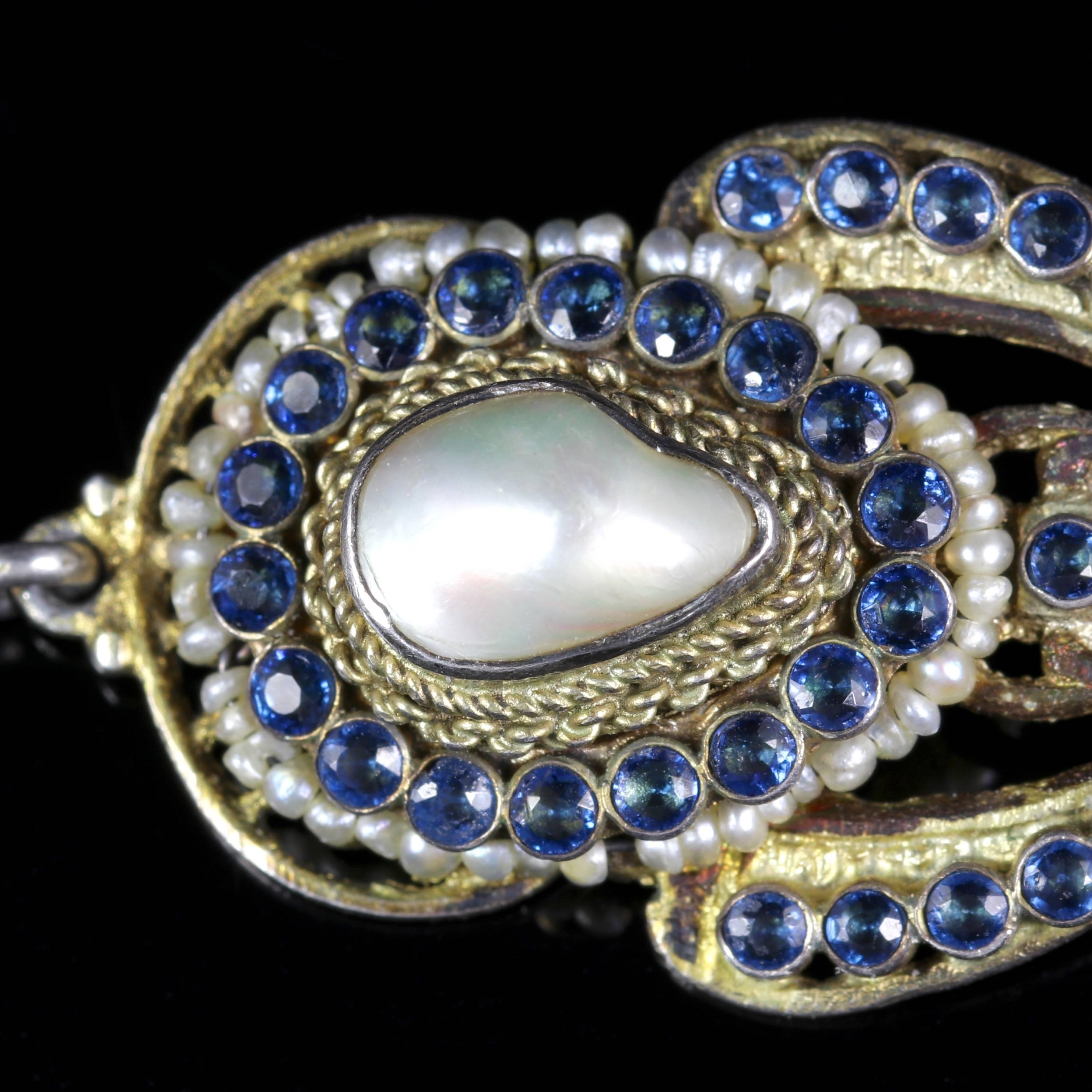 A genuine pair of Victorian Silver gilt earrings which are set with natural rich blue Sapphires and Baroque Pearls.

Three beautiful Baroque Pearls sit in the central gallery of the earrings.

Pearls have a wonderful lustre with a rich creamy tone,