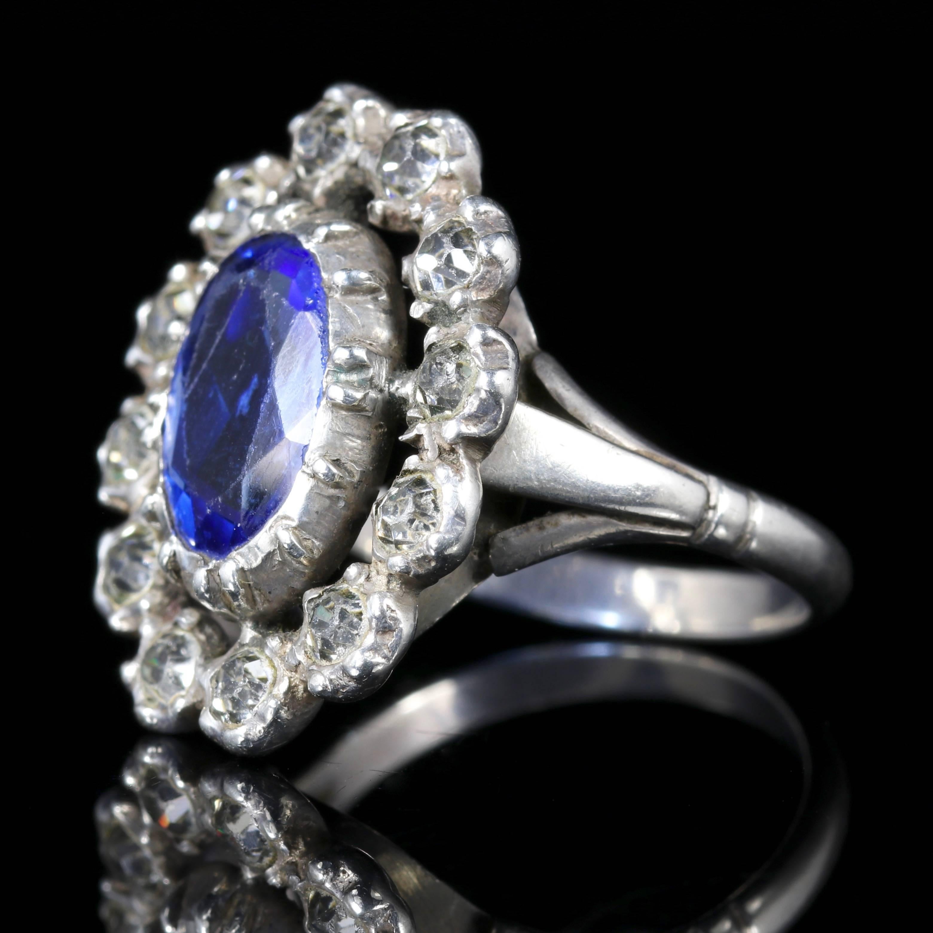 This fabulous Georgian Antique Paste ring is set with a lovely central deep blue Paste Stone surrounded by white Old Cut Paste Stones.

The ring is Georgian Circa 1800.

The blue central Paste Stone measures over 4ct in size.

Old Cut Paste Stones