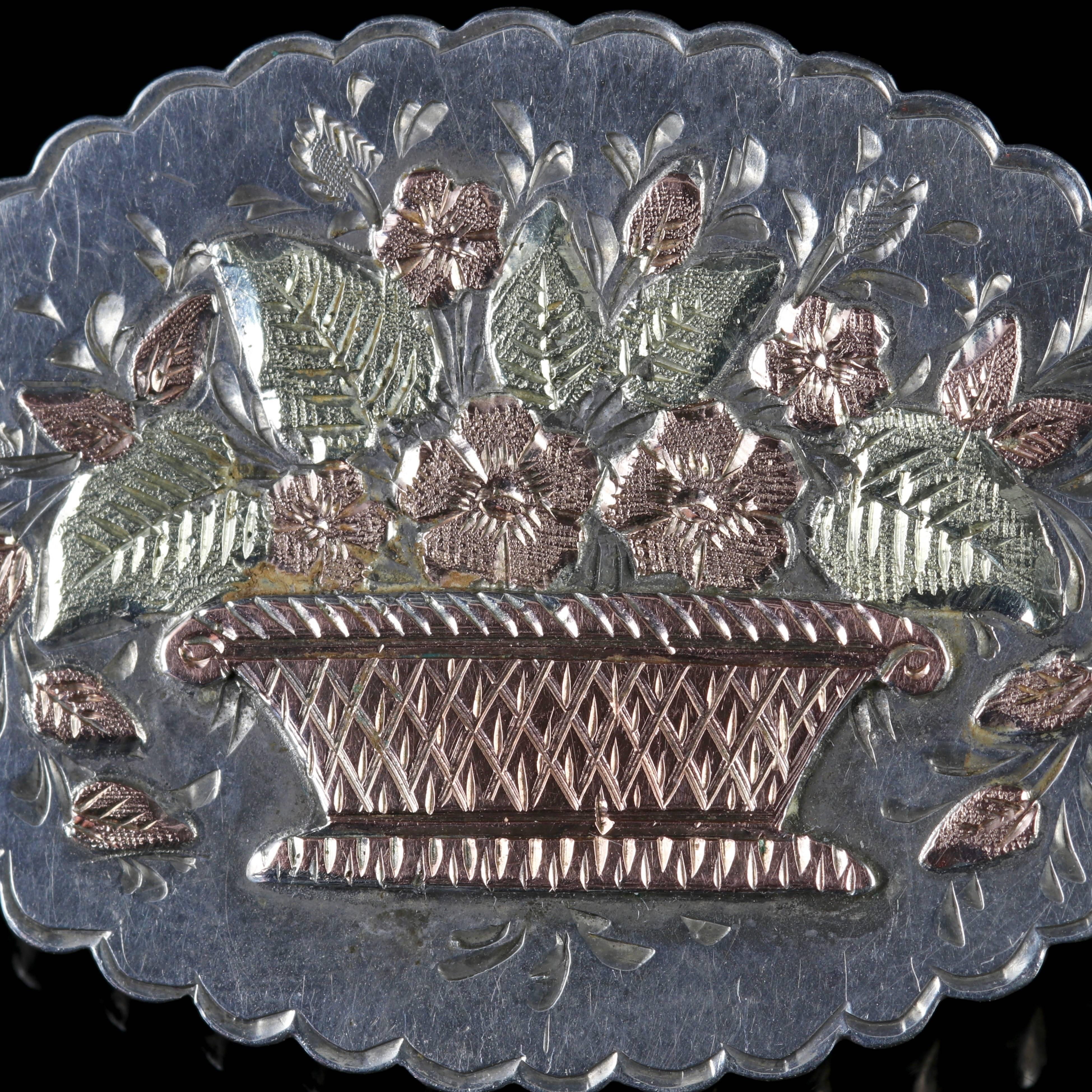 This fabulous Antique Victorian Silver brooch depicts a beautiful bouquet of flowers cascading from a basket.

Fully hallmarked Birmingham 1888.

The Brooch is set in Silver with an 18ct Yellow Gold/ Rose Gold bouquet in the centre.

Detailed
