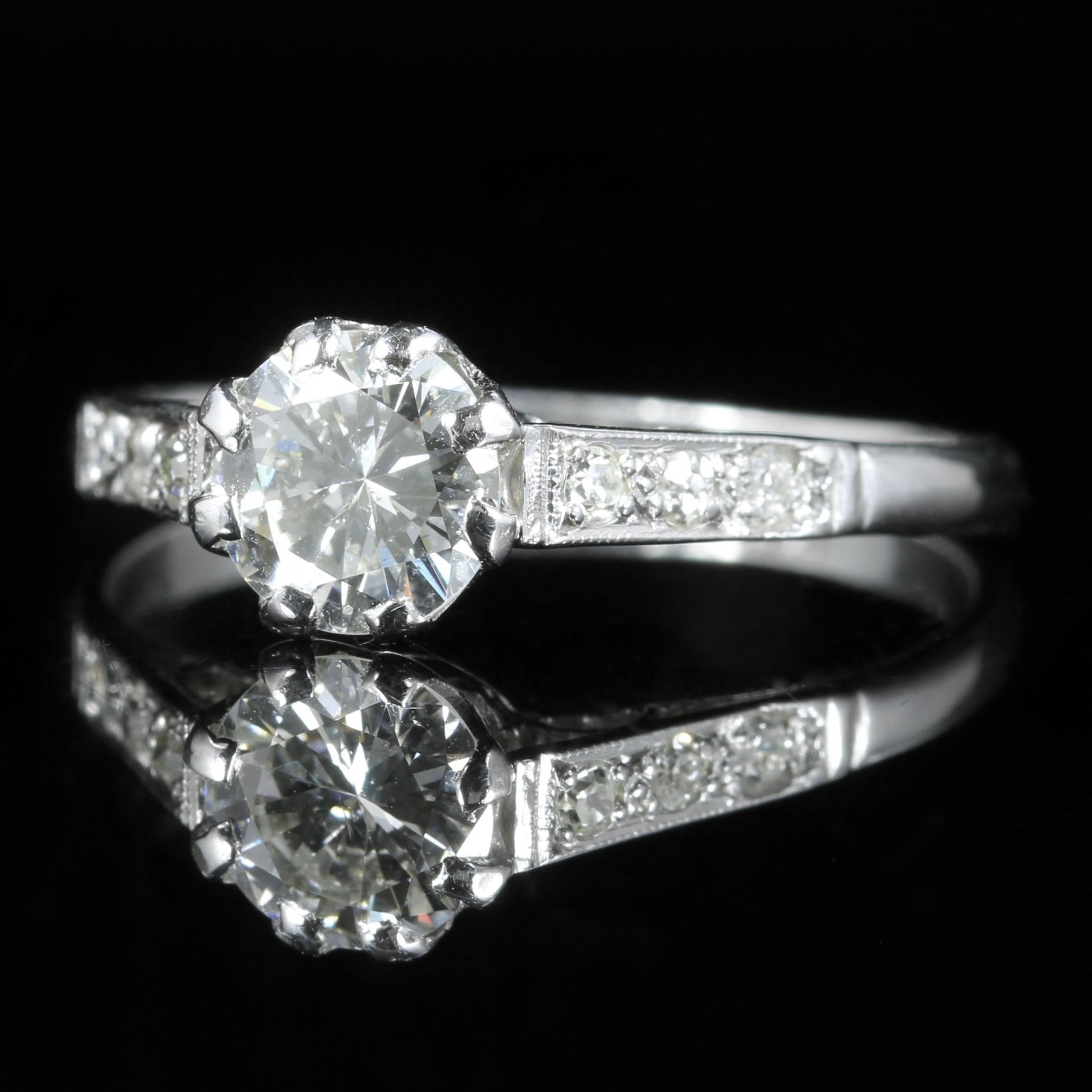 This spectacular Edwardian antique Platinum ring boasts a 0.90ct old cut Diamond which is original to the gallery.

Three Diamonds also chase down each shoulder, they are all superb colour cut and clarity - SI 1/2 H Colour.

Diamonds sparkle