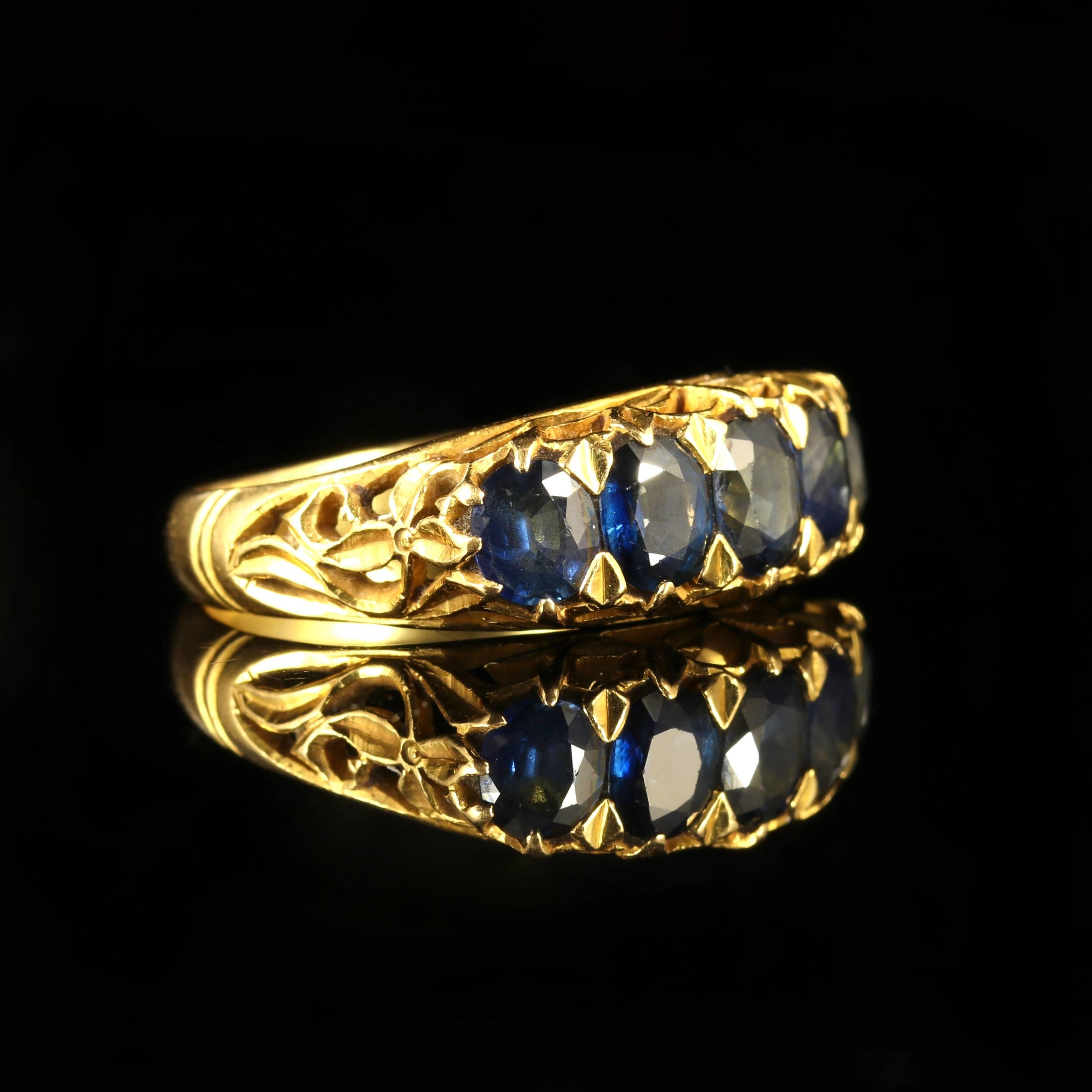 This fabulous Victorian Sapphire ring is Circa 1900.

With Five beautiful rich Sapphires that are set into the lovely gallery.

Set in 18ct Yellow Gold ornate gallery and tested with jewellers acid.

Sapphire is the symbol of feelings of sympathy,