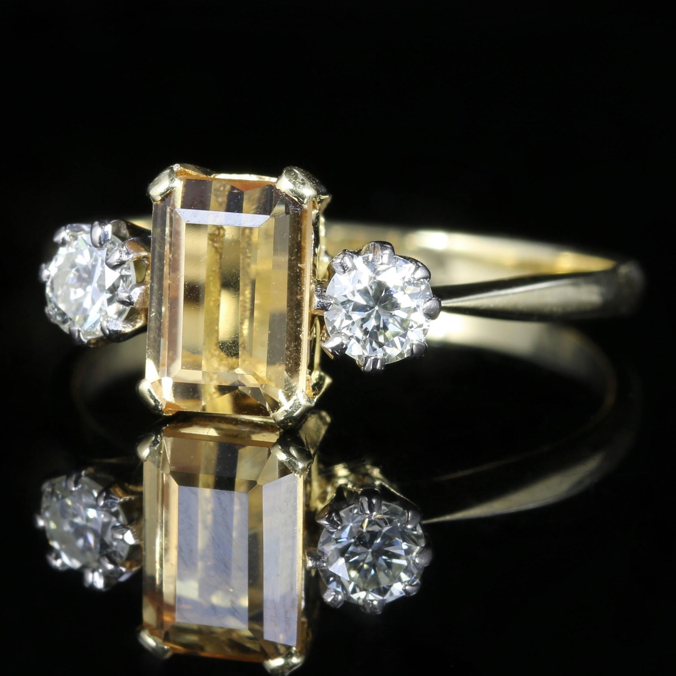 This fabulous 18ct Yellow Gold ring is set with a 1.15ct emerald cut Yellow Sapphire in the centre with two beautiful sparkling old cut Diamonds either side. 

Each Diamond is 0.60ct each 0.12ct in size.

The Diamonds are SI I colour

The Diamonds
