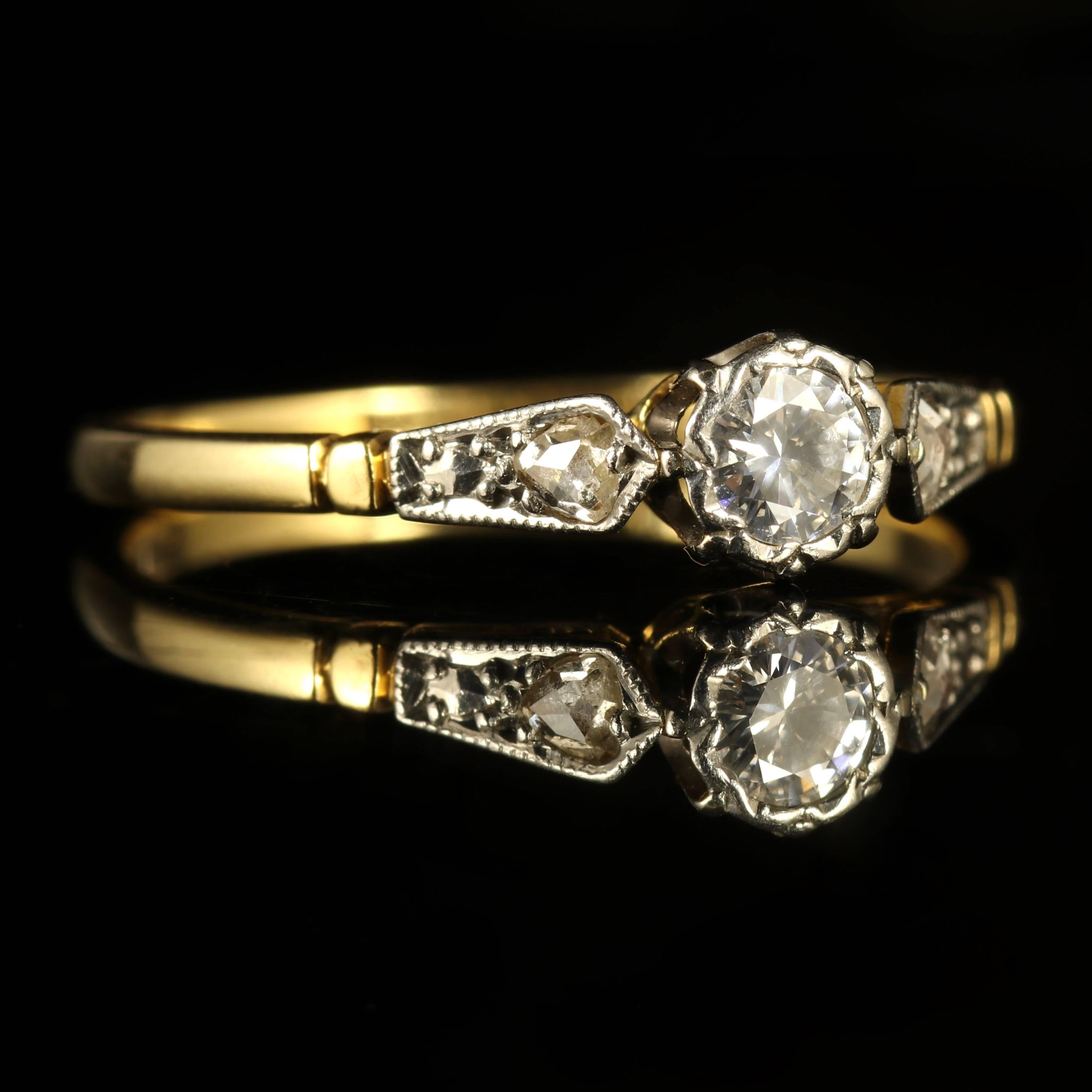 This fabulous 18ct Yellow Gold and Platinum engagement ring is genuine Edwardian Circa 1914.

Set with a lovely old cut Diamond in the centre.

The Diamond is approx. 0.20ct and SI 1 H colour.

Diamonds that chase down the shoulders of this lovely