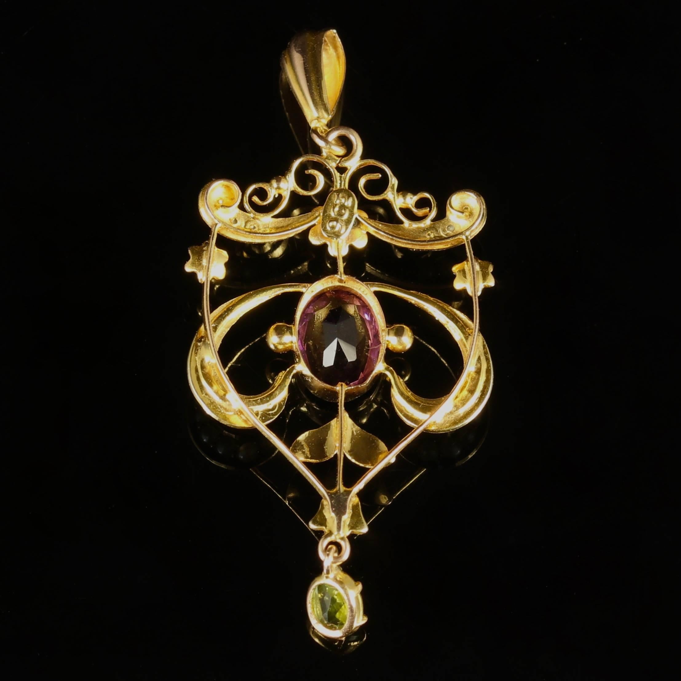 This genuine Victorian 9ct Yellow Gold pendant is Circa 1900.

Set with a deep Purple amethyst, rich Olive Green peridots and lustrous Pearls.

Suffragettes liked to be depicted as feminine. Their jewellery was chosen to counter the stereotypes put