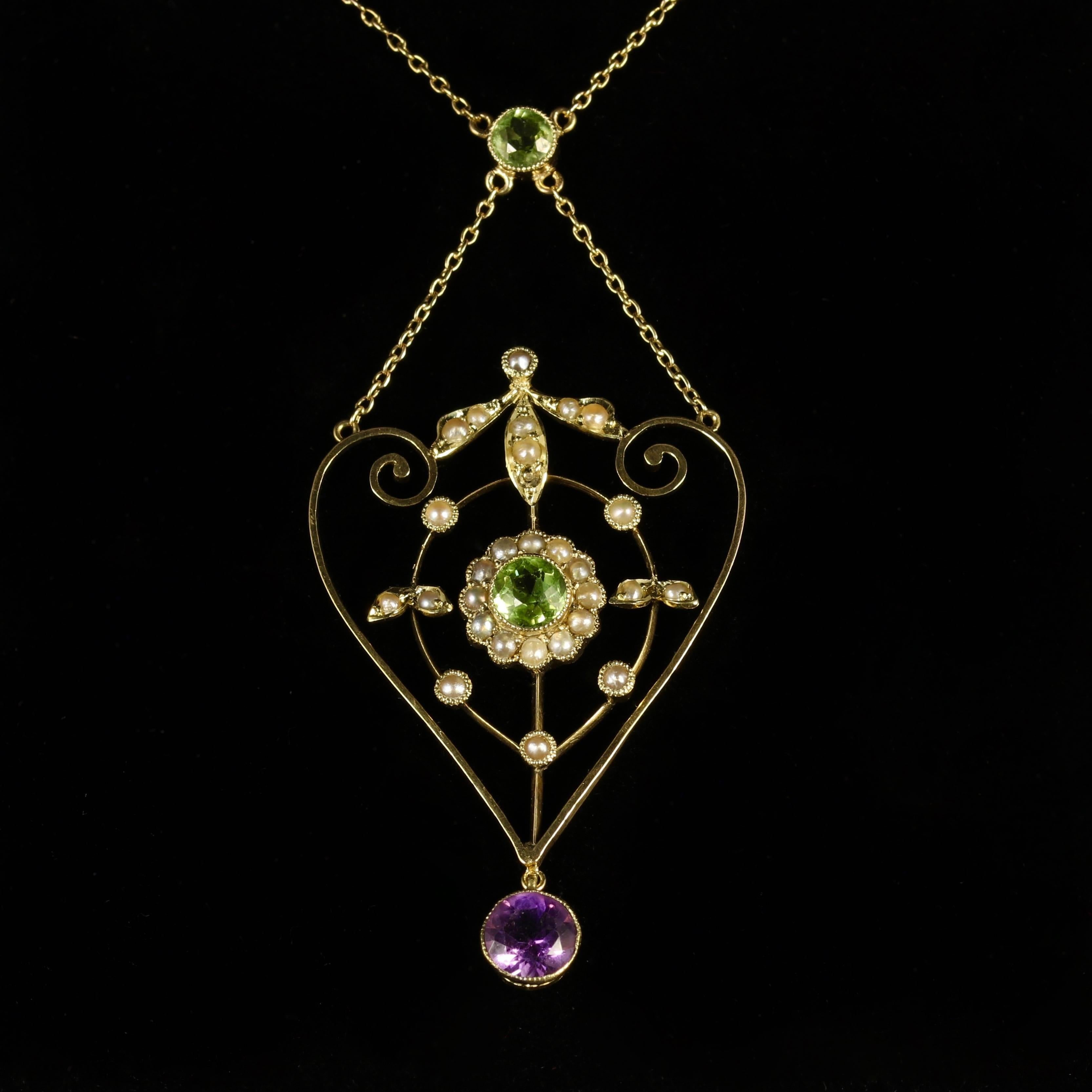 This genuine Victorian 9ct Yellow Gold pendant necklace is Circa 1900.

Set with a deep Purple Amethyst, rich Olive Green Peridots and lustrous Pearls.

Suffragettes liked to be depicted as feminine. Their jewellery was chosen to counter the