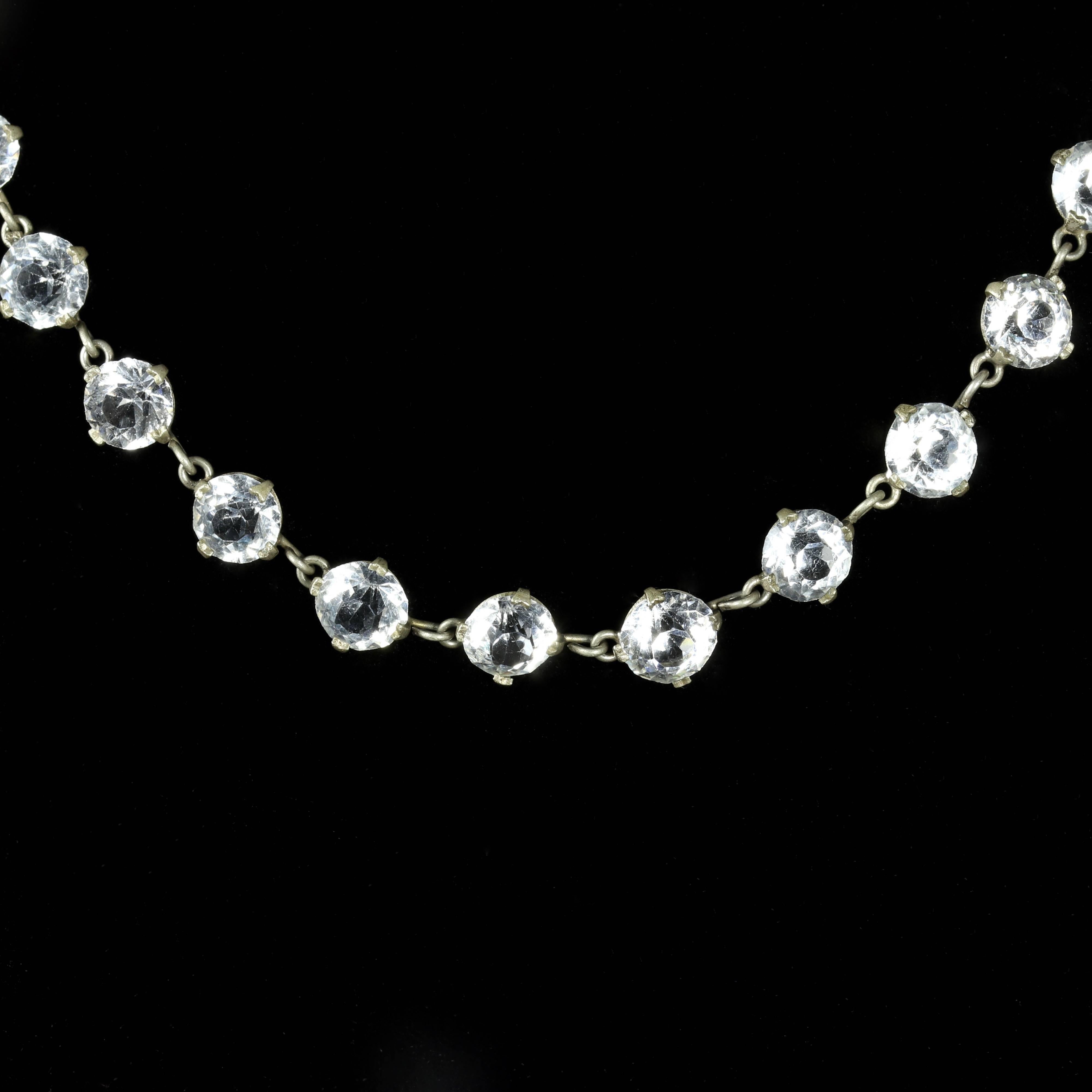This fabulous Sterling Silver Paste Stone necklace is Circa 1900.

Beautiful round Paste Stones sit around the neck and cascade down beautifully, all set in White metal.

Paste is a heavy, very transparent flint glass that stimulates the fire and