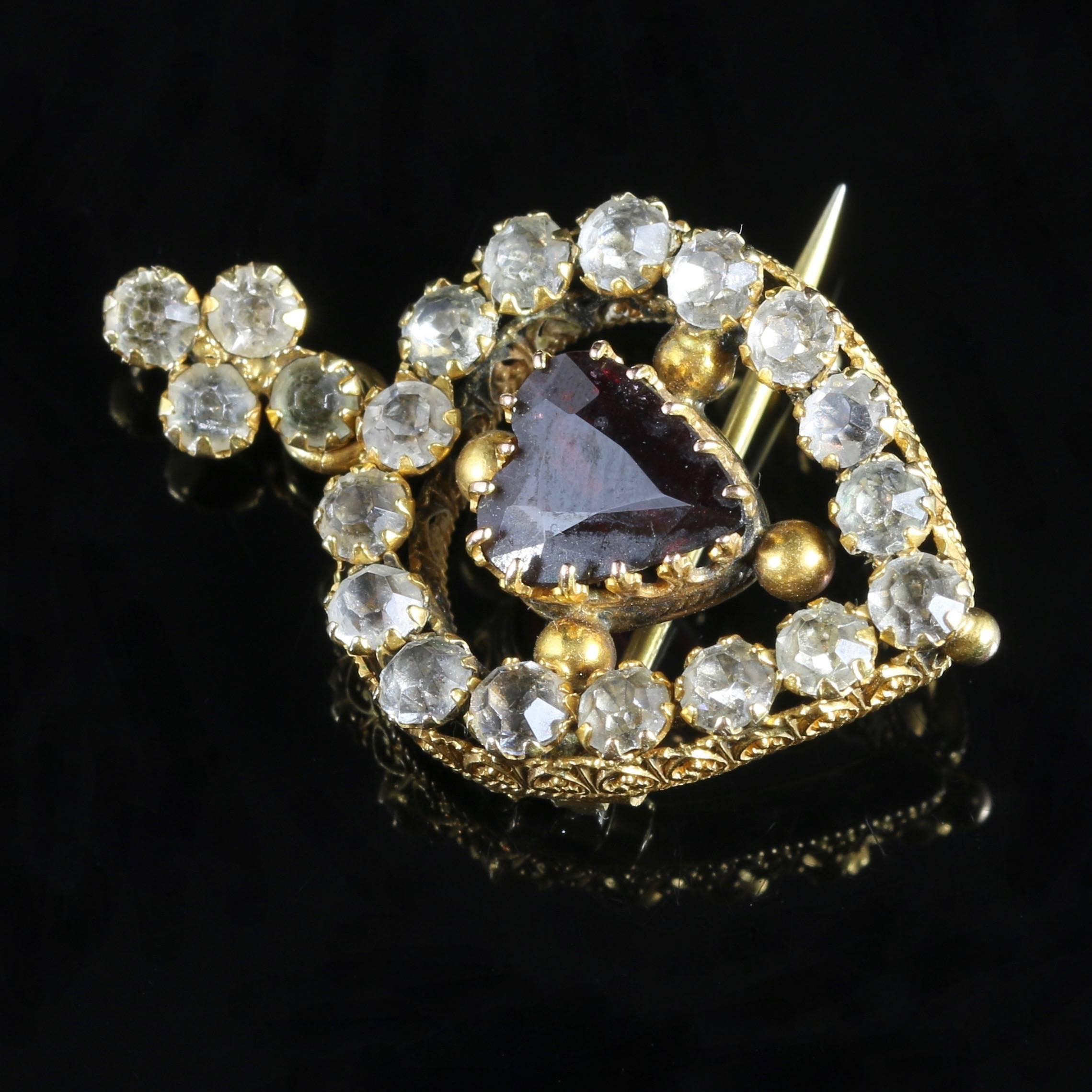 This very beautiful 18ct Gold Victorian pendant brooch is set with a Garnet heart in the centre.

The Garnet is over 1ct in size, and hand cut to perfection.

The Garnet is a stone of purity and truth as well as a symbol of love and compassion. The