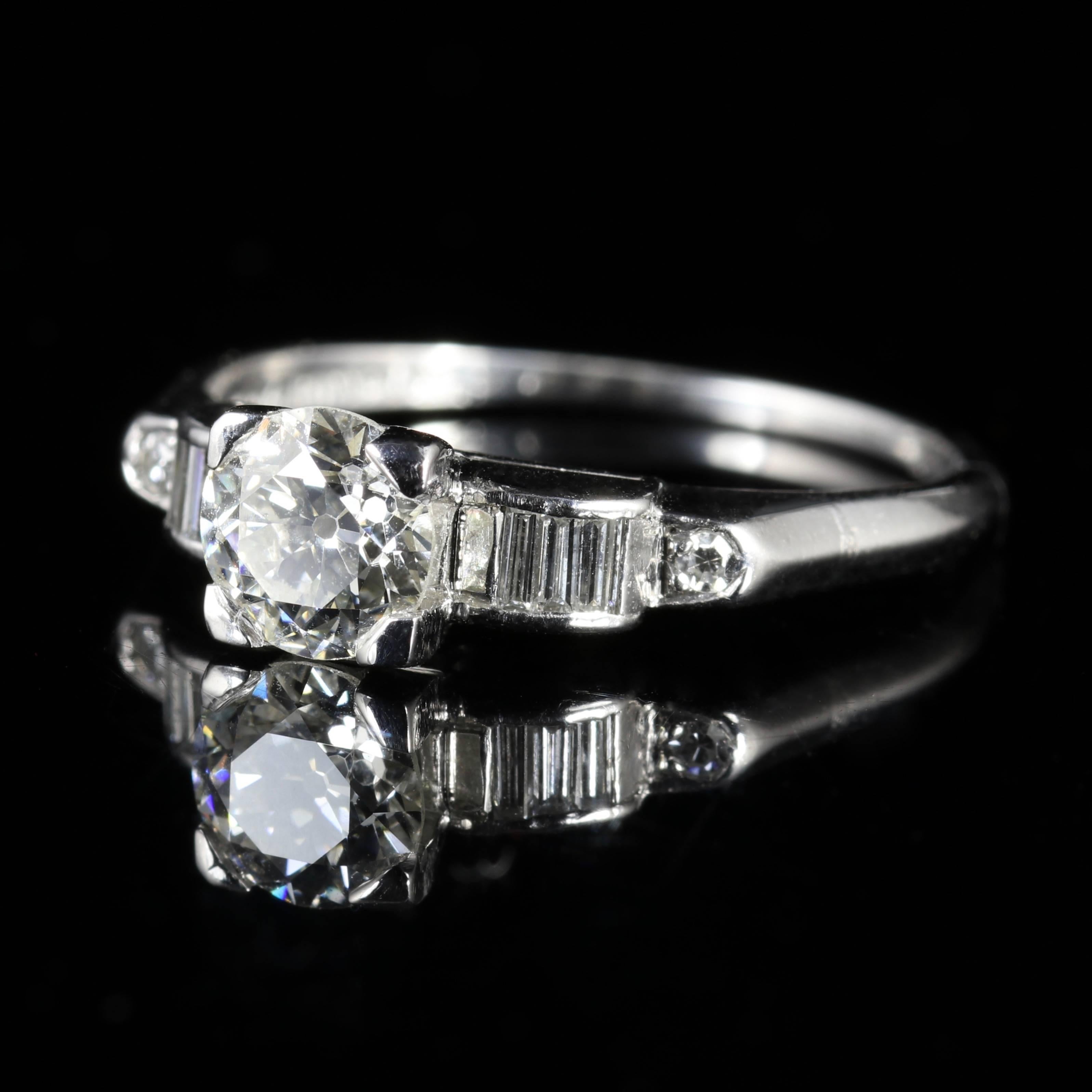 This beautiful 1.25ct Art Deco ring is circa 1920 - Set with a lovely old cut Diamond and Baguette Diamond shoulders.

Fully hallmarked Platinum with an inscription inside the shank of the initials of two loved ones gone by.

The central Diamond is