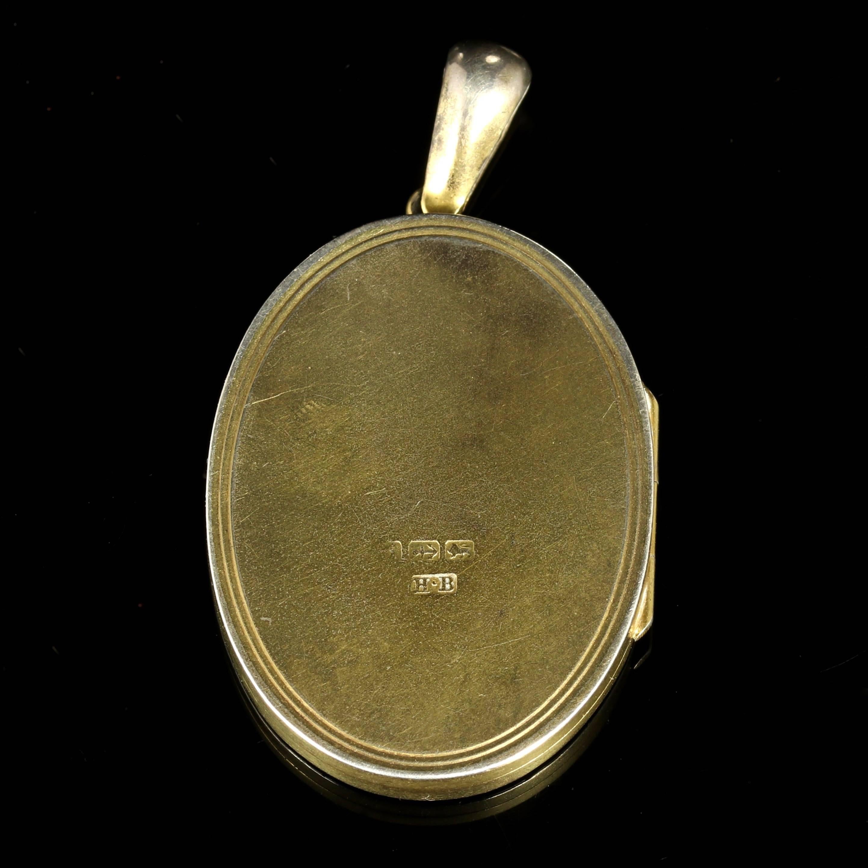 This fabulous Sterling Silver and Gold large locket is genuine Victorian, Circa 1880.

The front of the locket displays fabulous Gold workmanship in 18ct Yellow Gold and 18ct Rose Gold.

Forget-me-nots are seen on the front of the