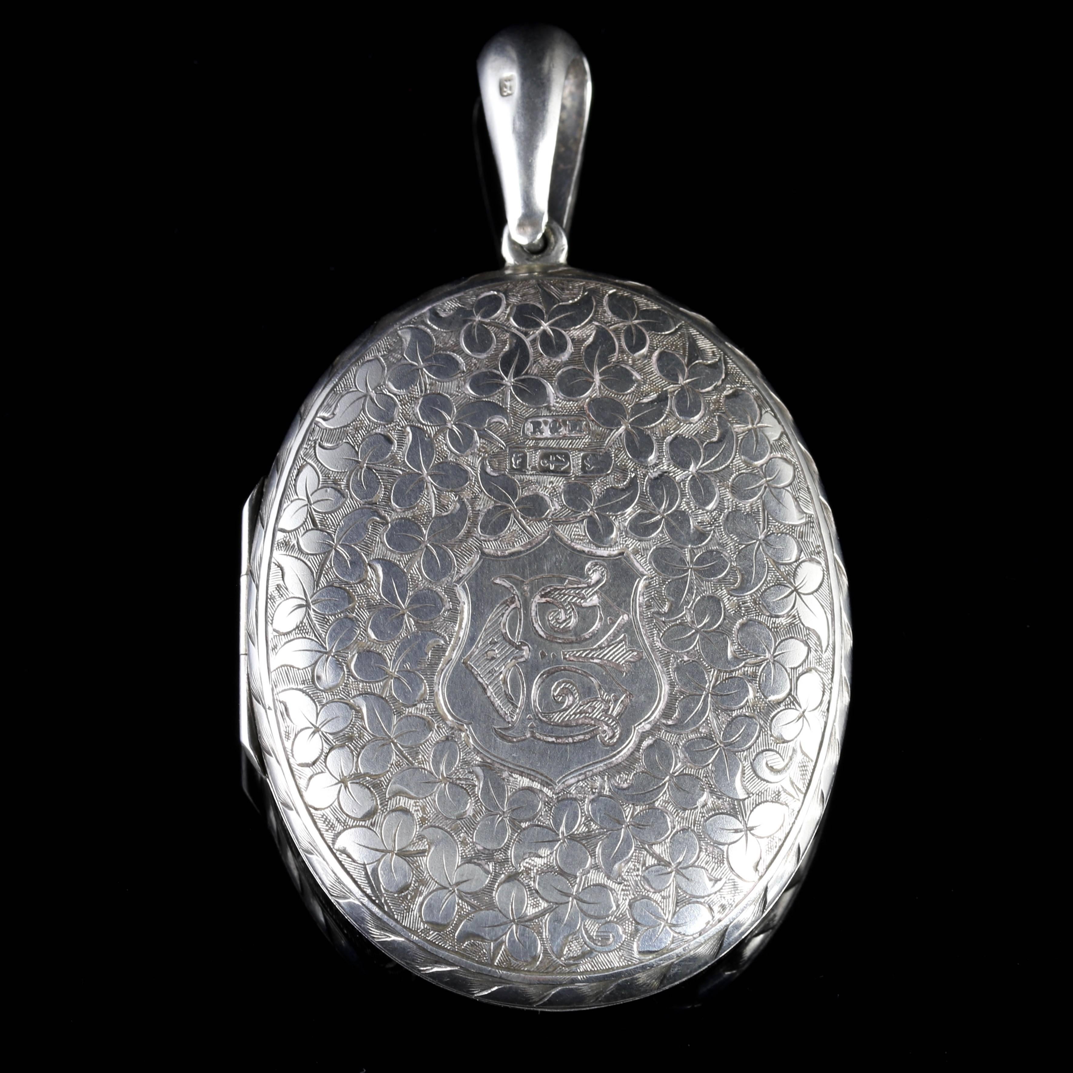 This fabulous Sterling Silver fully engraved large locket is genuine Victorian, Circa 1880.

The front of the locket displays fabulous workmanship.

Ivy can be seen around the outer panels of the locket.

Ivy is a symbol of - I cling to thee - a