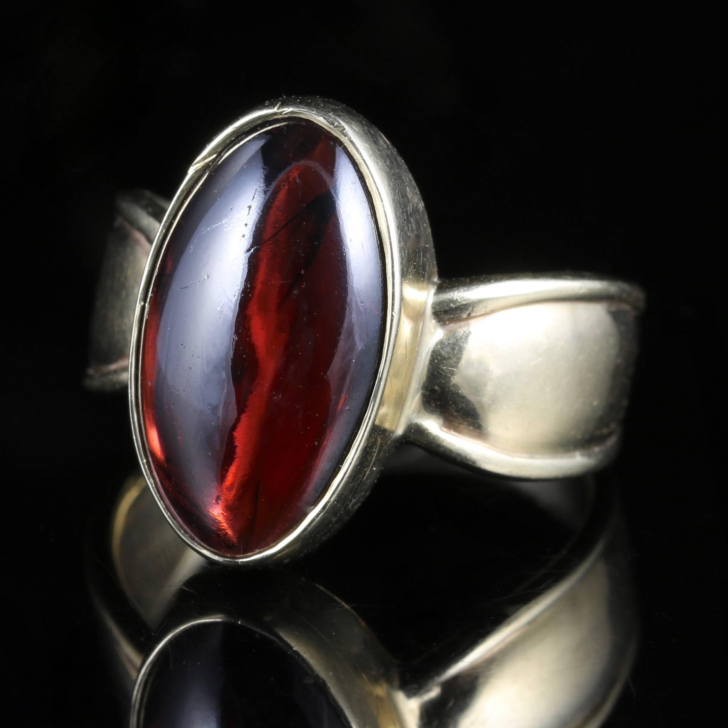To read more please click continue reading further down the page.

This genuine 9ct Yellow Gold Victorian cabochon Garnet ring is stunning, Circa 1900

Set with a large central Garnet which is over 6ct in size, and beautifully polished to