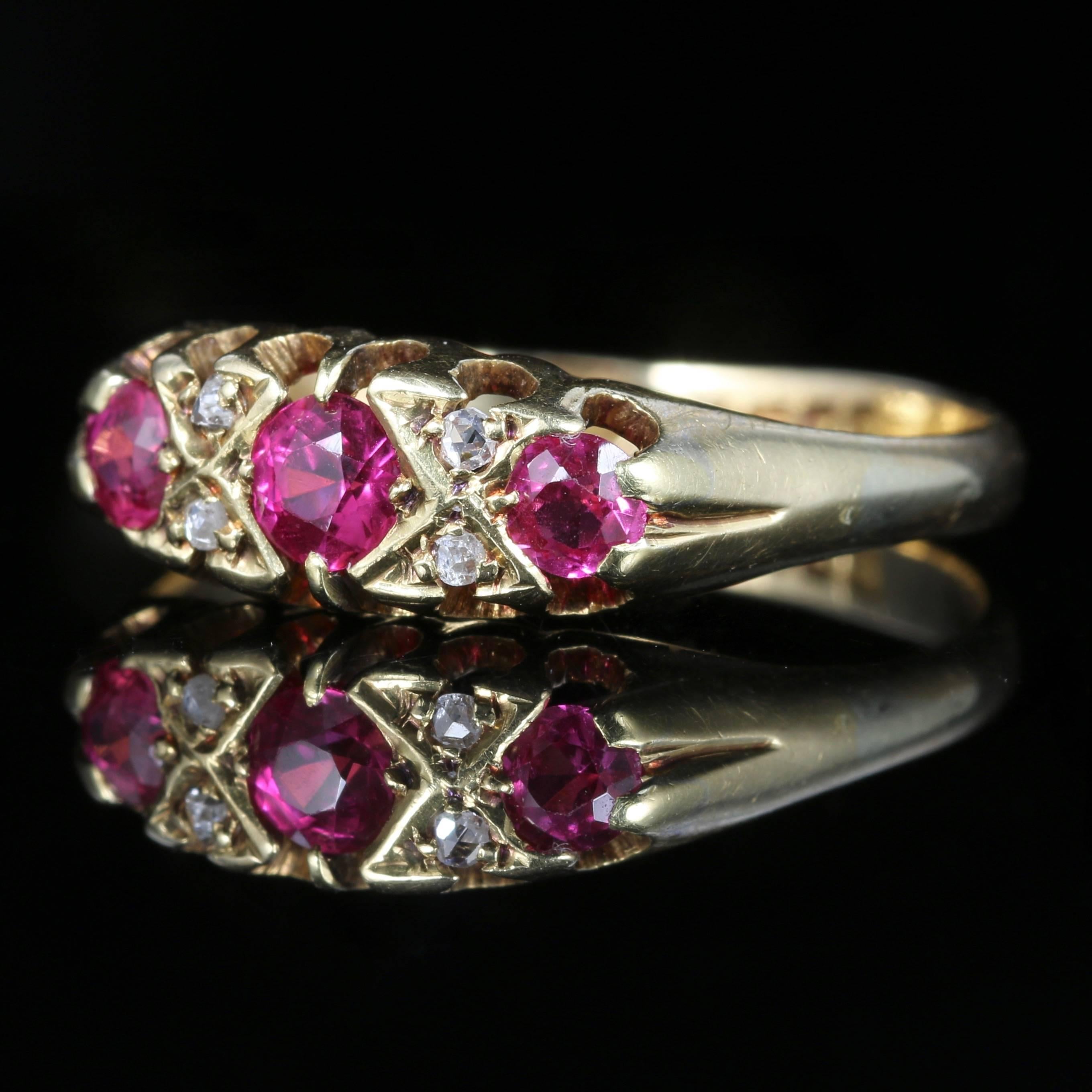 This fabulous 18ct Yellow Gold ring is fully hallmarked London 1869 

Set with a trilogy of Rubies, approx. 0.40ct in total. And 4 sparkling diamonds nestled in between. 

The Ruby is considered to be the most powerful gem of the universe, given as