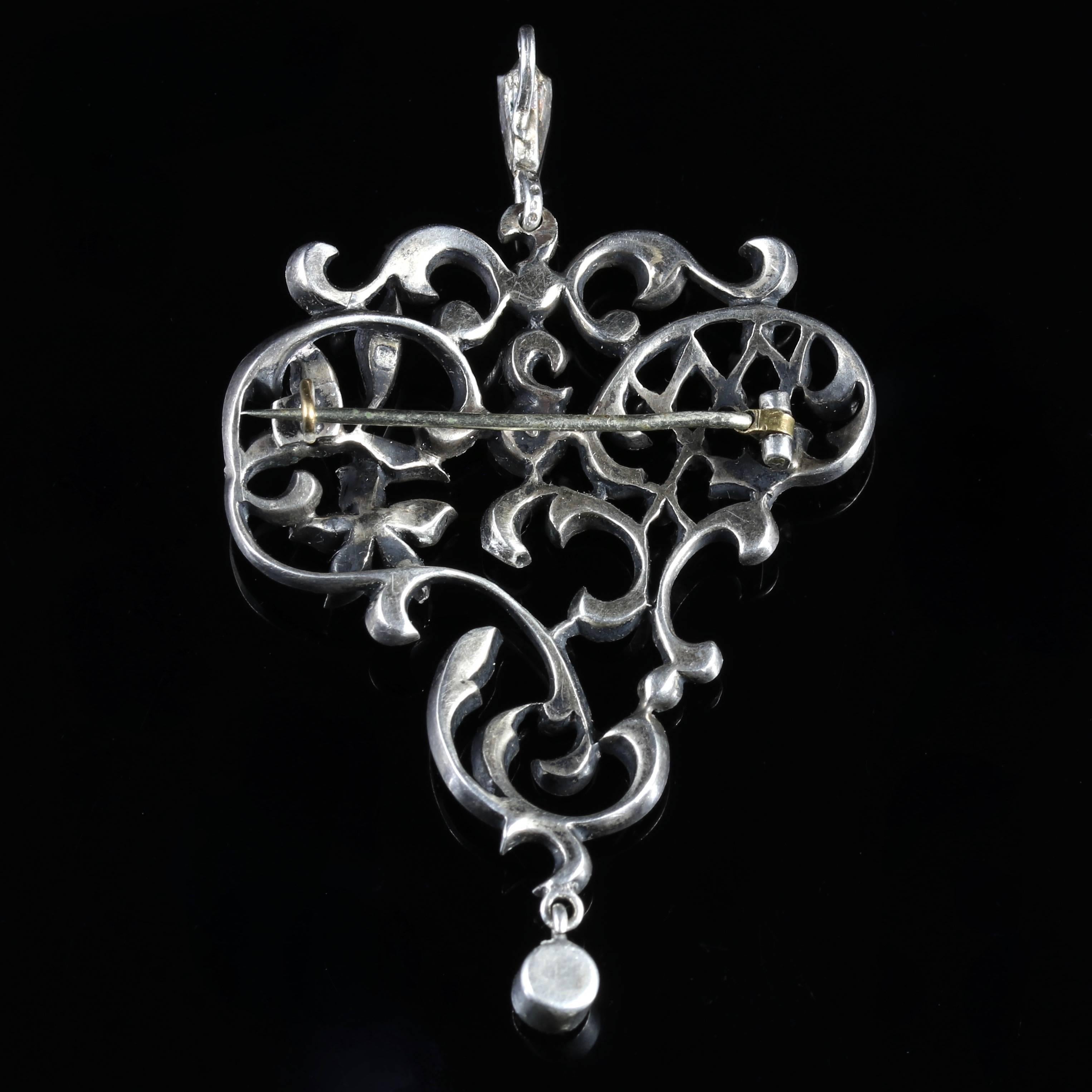 This fabulous Victorian Sterling Silver pendant brooch is adorned with old cut Paste Stones, all original, with the pin and C catch - Circa 1880.

The bale is set with Paste Stones, leading to beautiful, floral workmanship.

Paste is a heavy, very