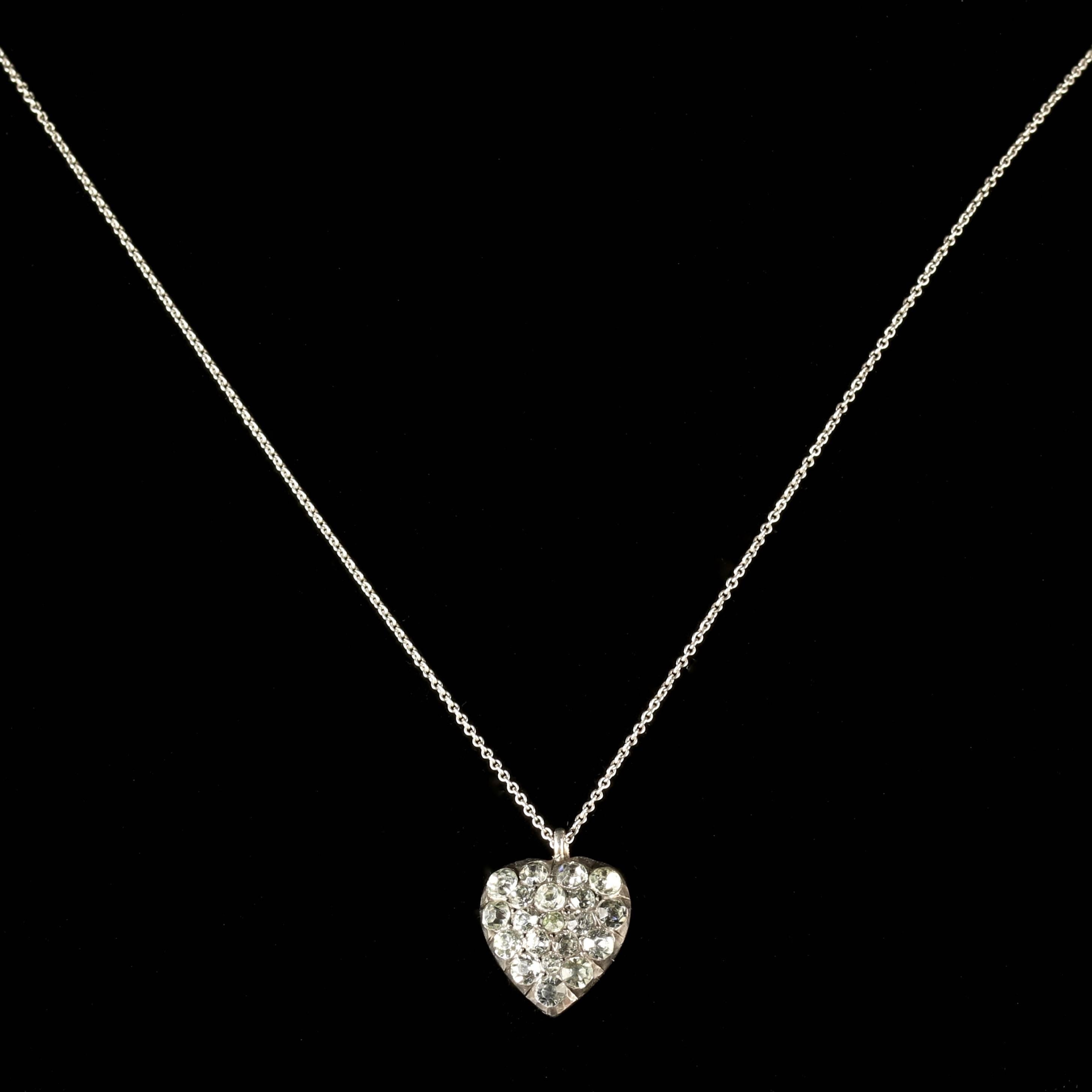 This very beautiful Sterling Silver Georgian Paste heart pendant is Circa 1800.

Stunning bright White Paste Stones adorn this fabulous Georgian heart, set on a Silver chain, all
