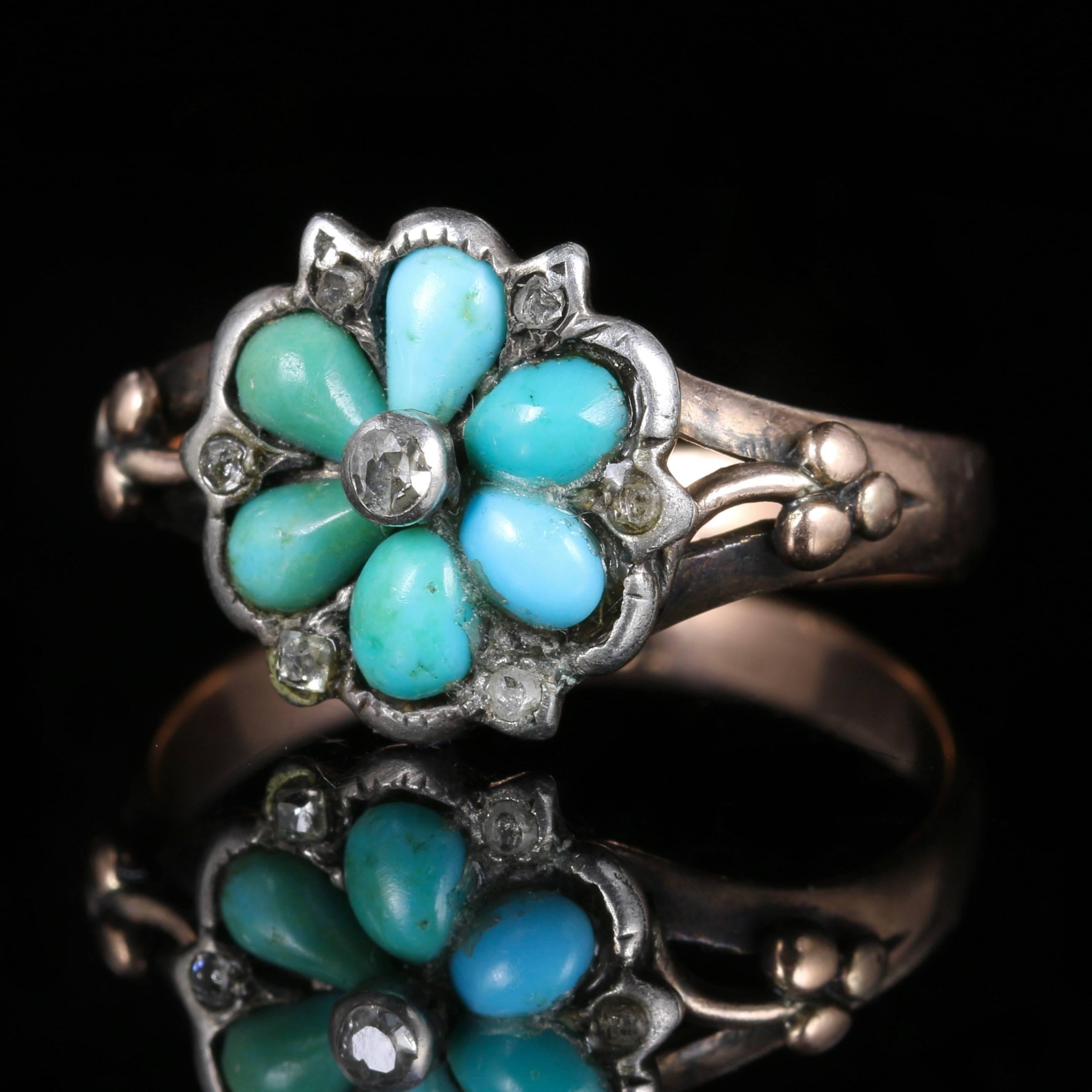 This fabulous genuine Georgian antique ring is from the 1830’s, set in 18ct Yellow Gold.

Adorned with Turquoise stones and a halo of Diamonds surrounding, complimented with a central Diamond.

The Turquoise stone has healing properties, it protects