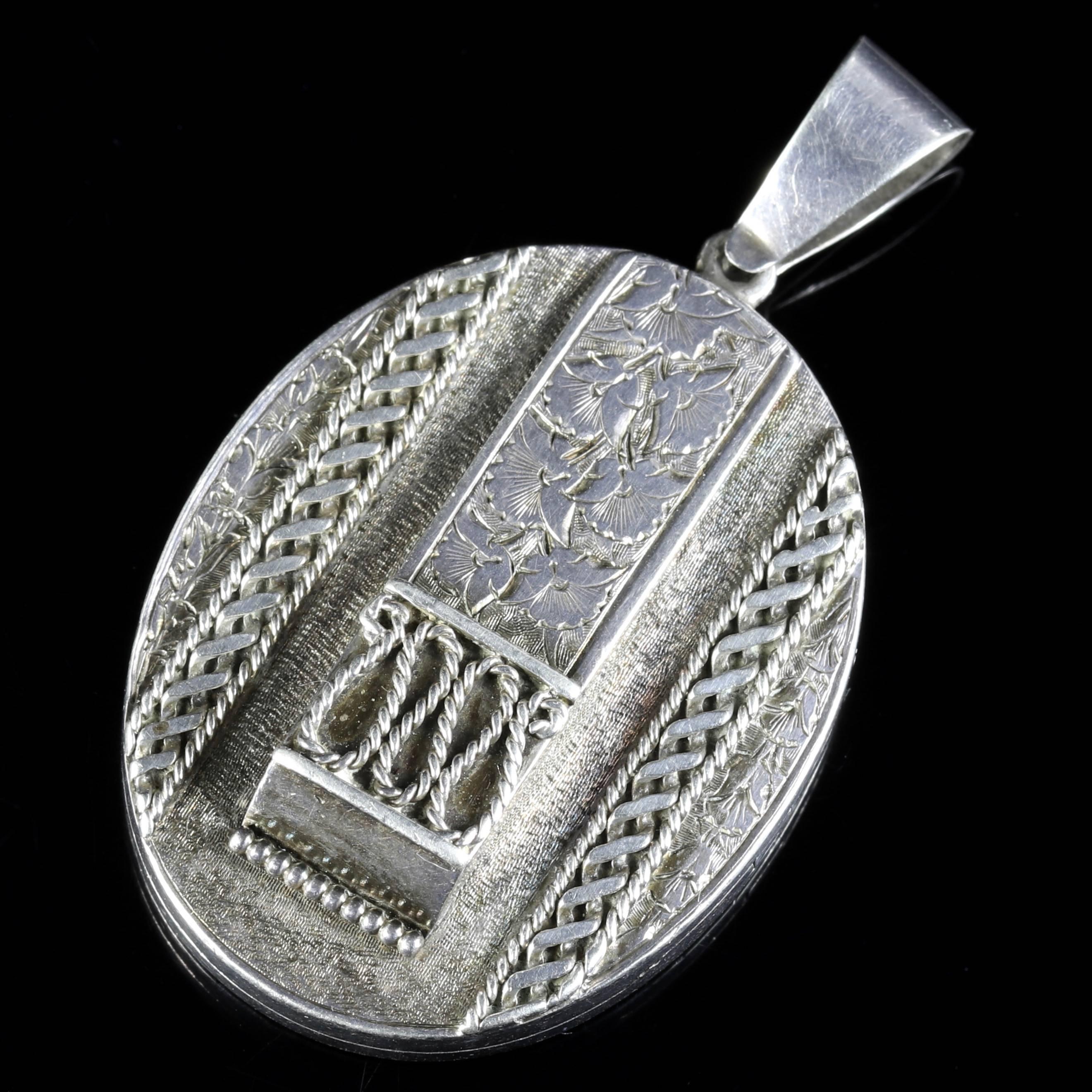 This genuine Victorian Sterling Silver locket is Circa 1900.

The locket is engraved with ivy.

Ivy stands for I cling to thee a beautiful romantic engraved symbol of love.

Beautiful workmanship can be seen all round.

The locket opens and closes