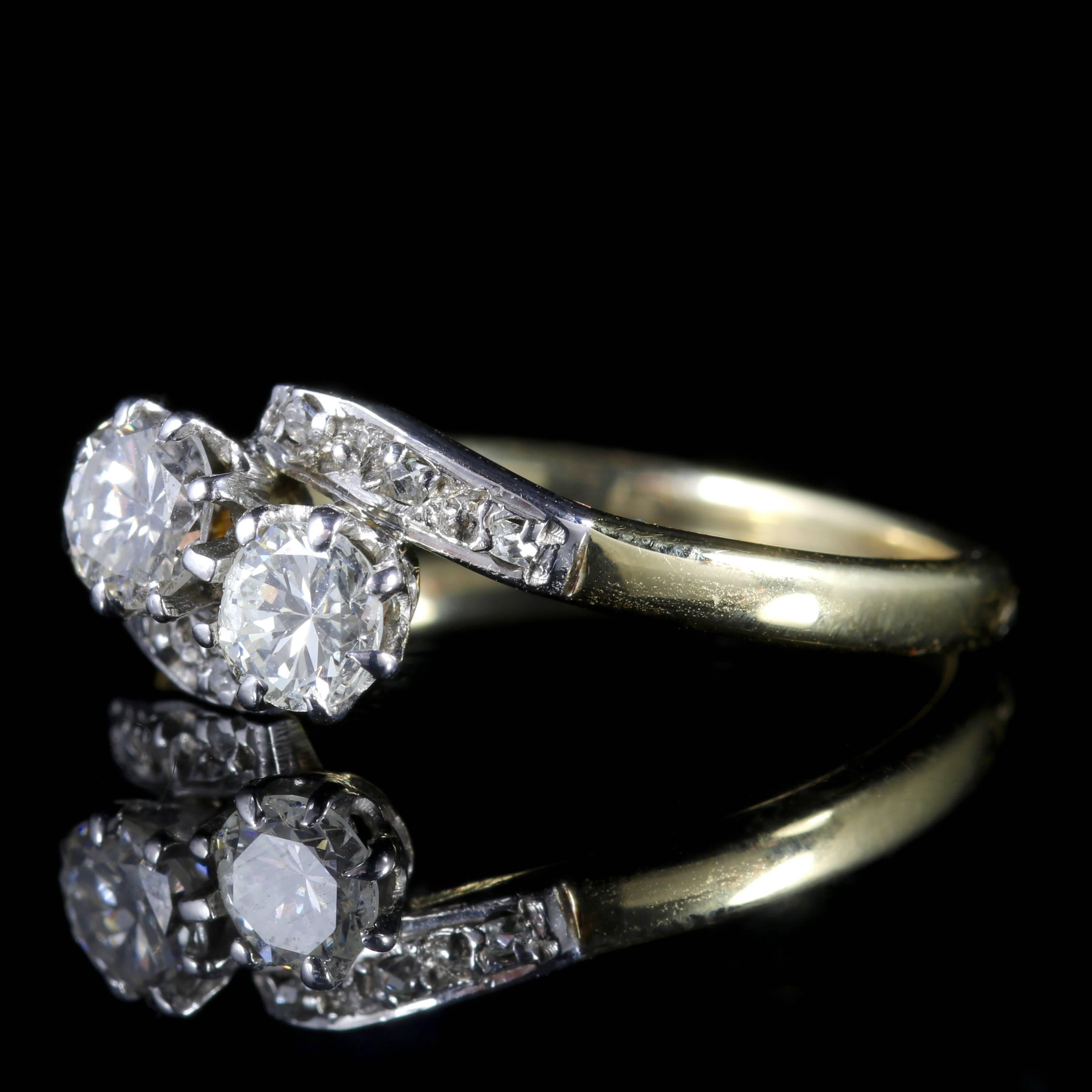 To read more please click continue reading below-

This genuine Antique Edwardian 18ct Gold and Platinum double twist ring is Circa 1910.

Two lovely old cut Diamonds sit in the central gallery with smaller Diamonds chasing down each shoulder.