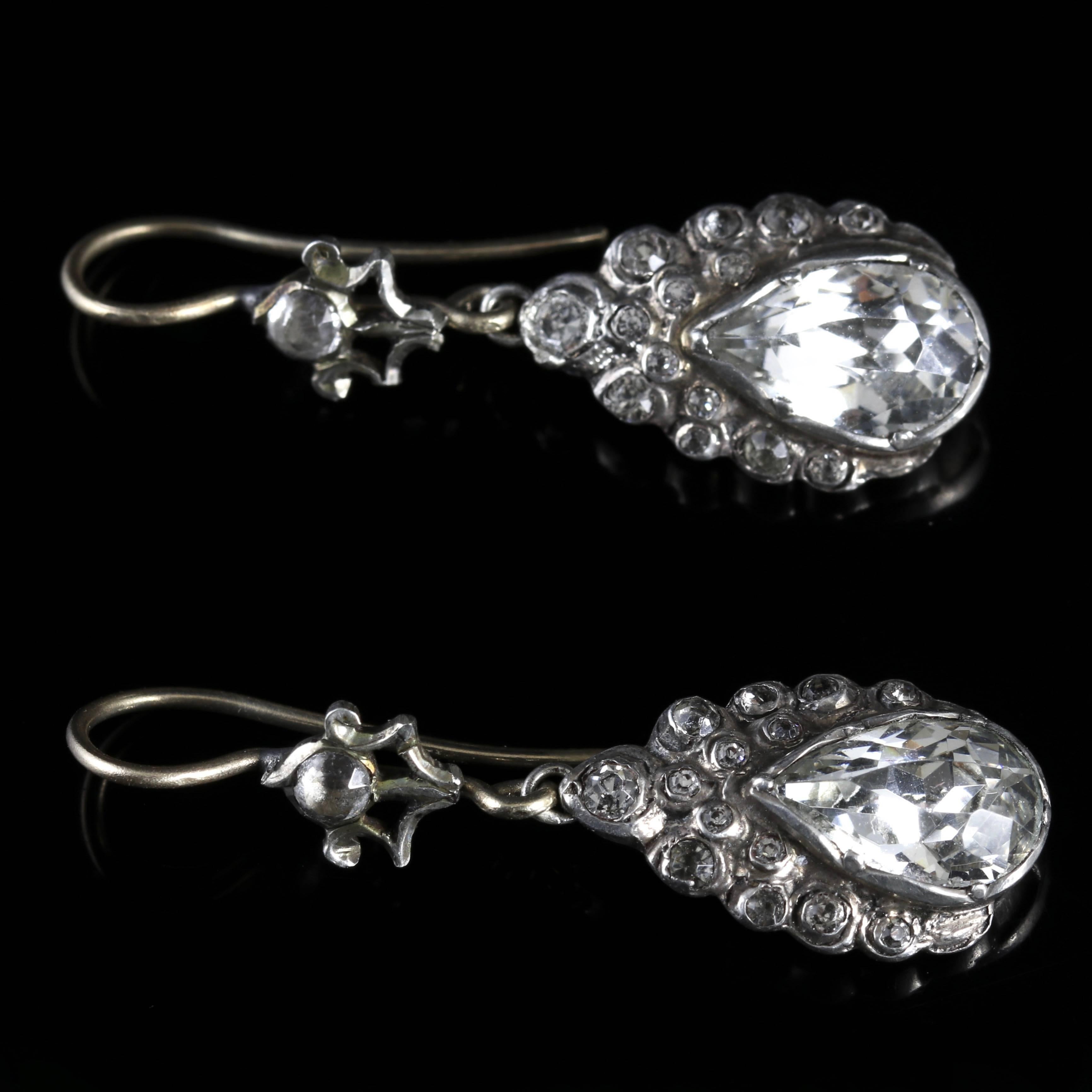 These fabulous Silver antique earrings are genuine Victorian, Circa 1900.

The earrings are set with beautiful pear shaped Paste Stones in a detailed Victorian gallery.

Each pear shaped Paste Stone is 1.65ct each.

The smaller Paste Stones adorn