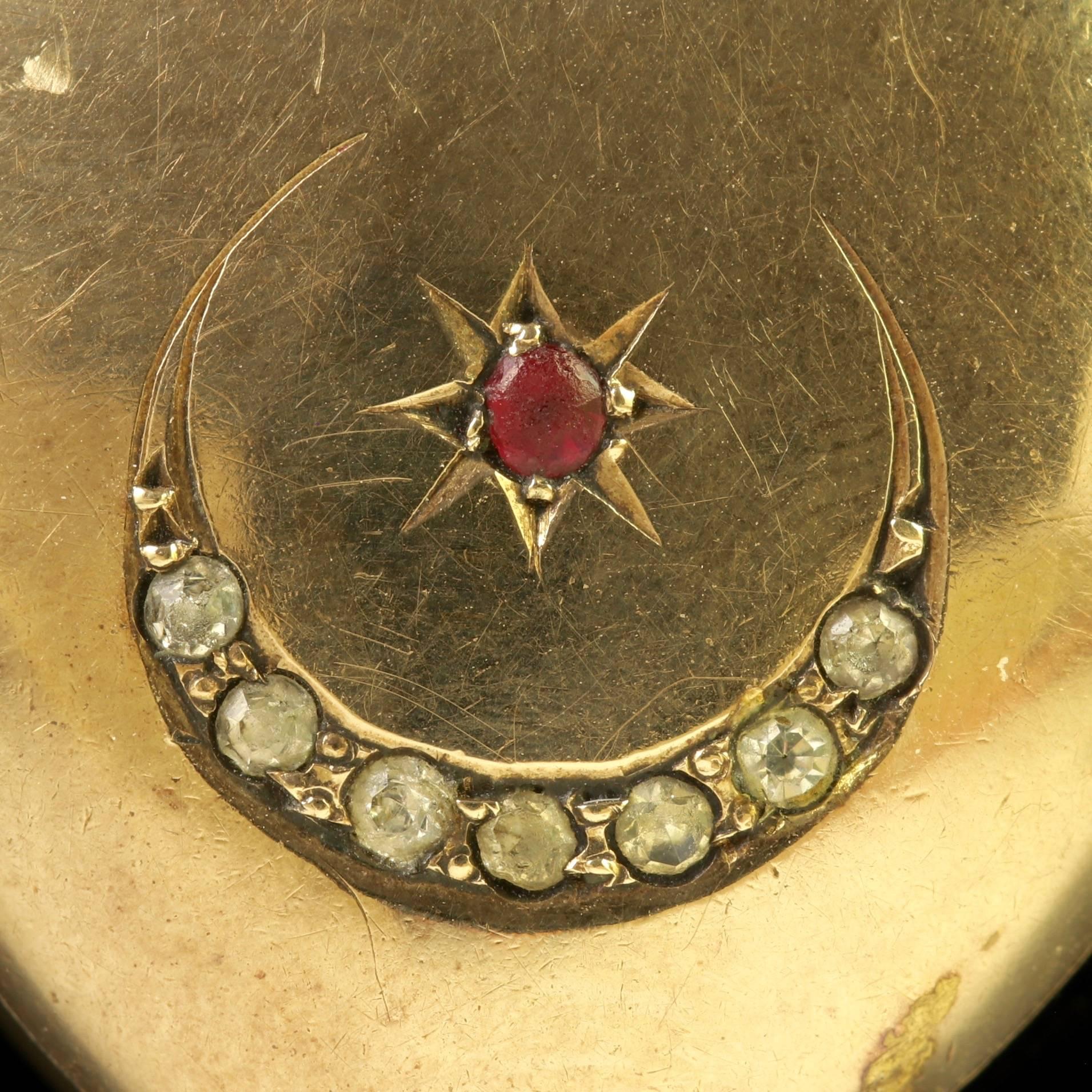 To read more please click continue reading below-

This fabulous Antique Victorian 9ct Gold back and front on Silver Locket is Circa 1900.

Set with a rich red Ruby star in the centre and a crescent moon decorated in white Paste Stones.

Star and