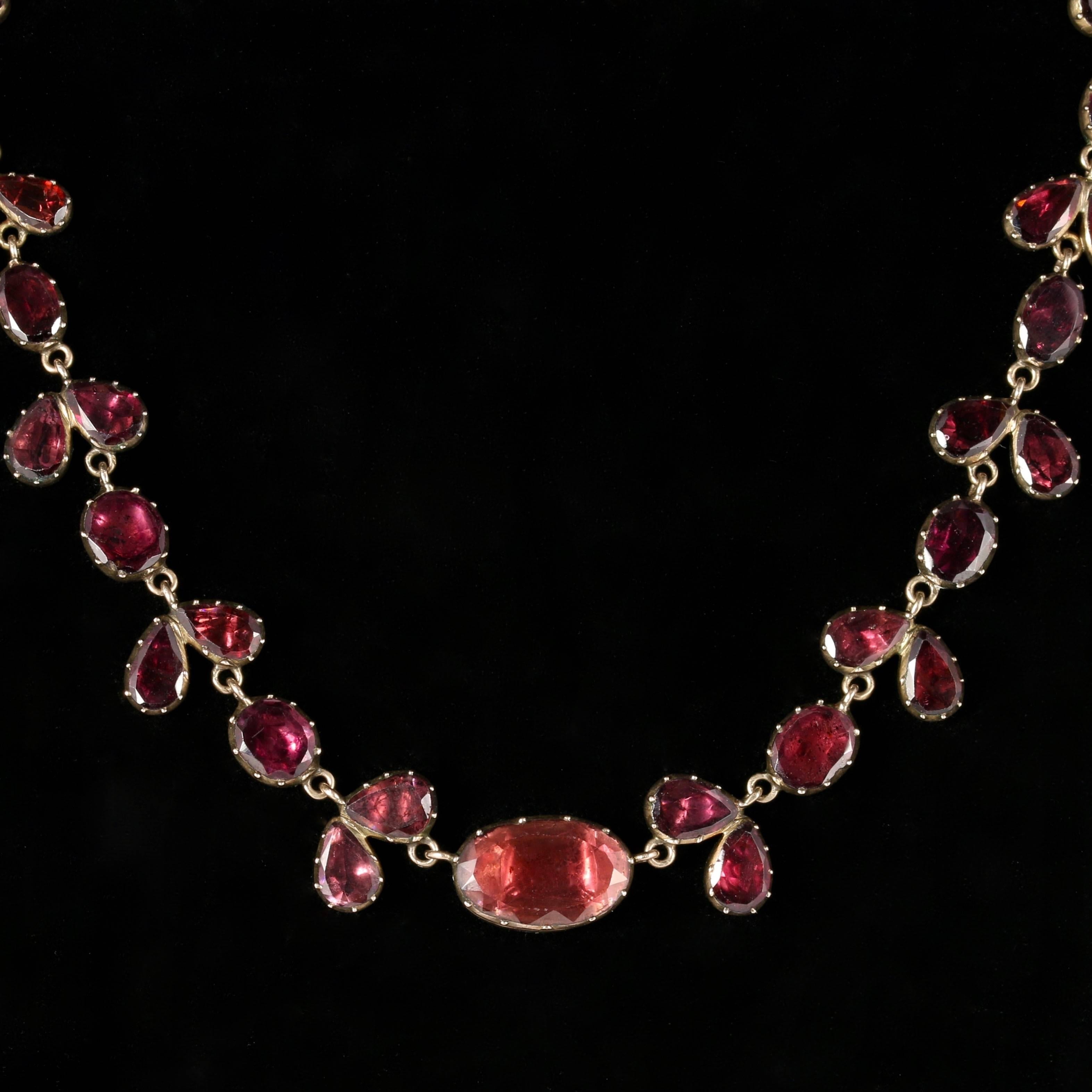 To read more please click continue reading below-

This stunning antique 18ct Gold Georgian flat cut Garnet Riviere Necklace is Circa 1790. 

Due to its age, Georgian jewellery is quite rare, with some pieces almost three hundred years old. From