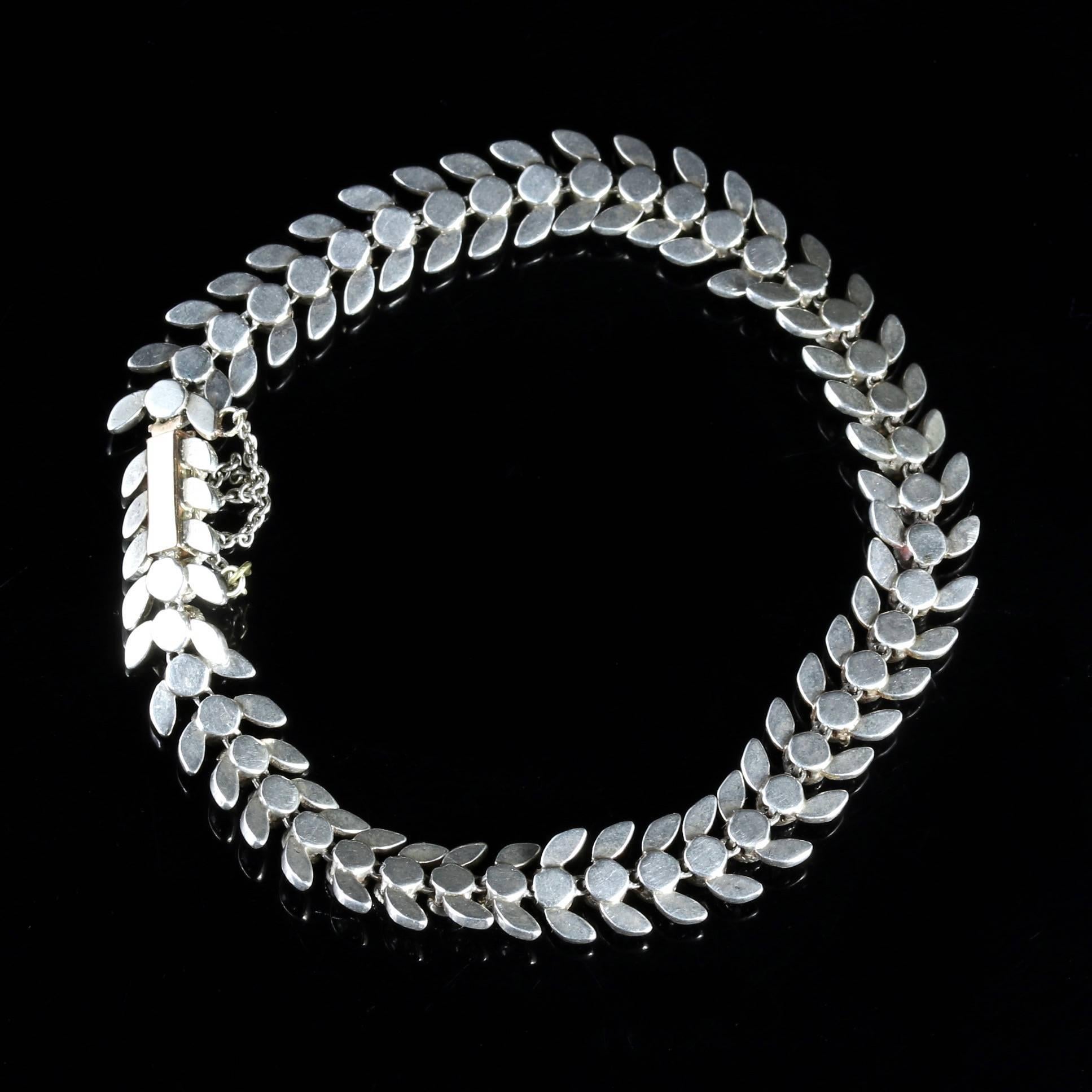 This fabulous Sterling Silver and Gold, Paste Stone Edwardian bracelet is Circa 1910.

Paste is a heavy, very transparent flint glass that stimulates the fire and brilliance of gemstones, the Romans in particular were very skilful in the production