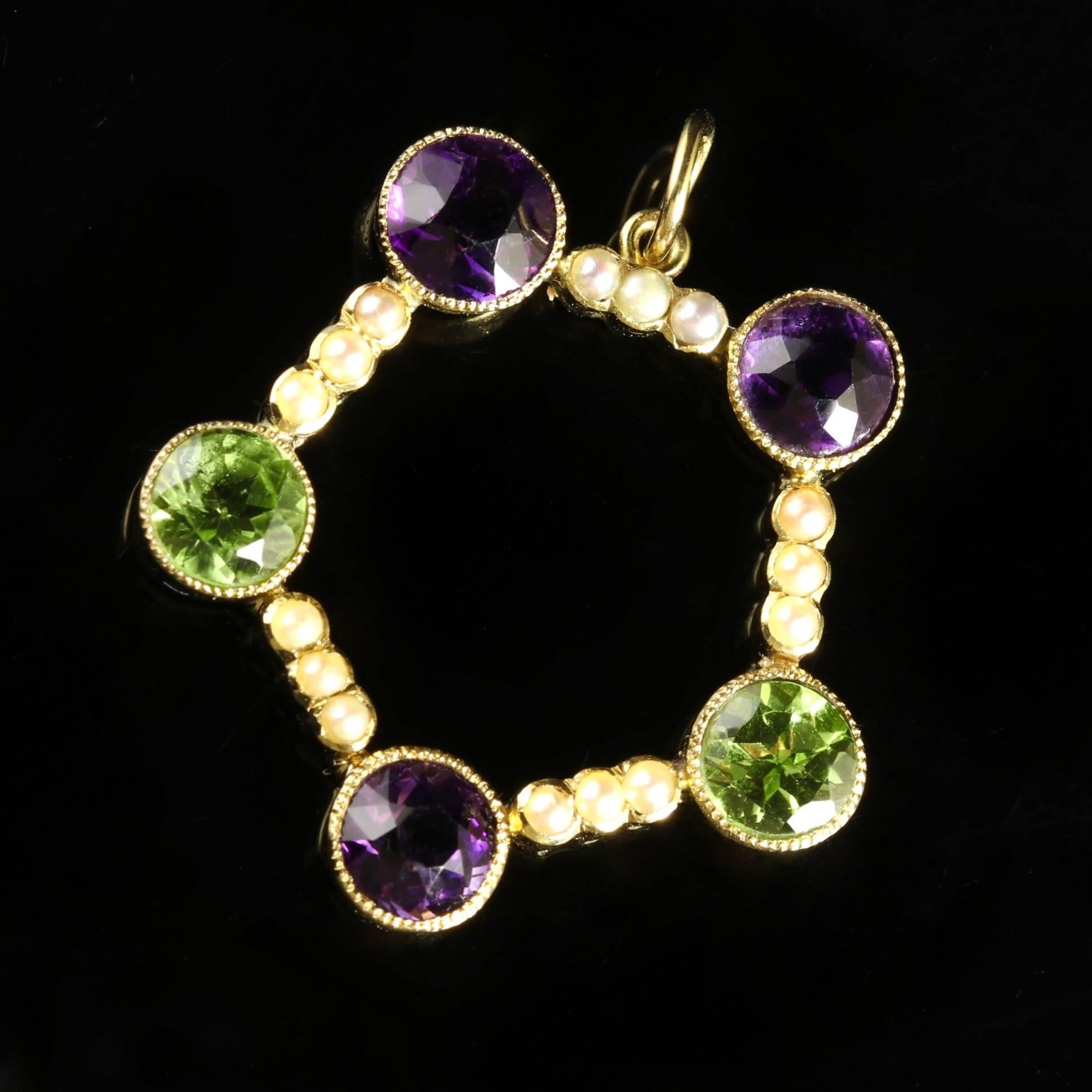 This genuine Victorian pentagon shape antique Suffragette pendant is modelled in 15ct Yellow Gold, Circa 1900.

This beautiful pendant is set with beautiful Peridots, Amethysts and Pearls.

Suffragettes liked to be depicted as feminine. Their