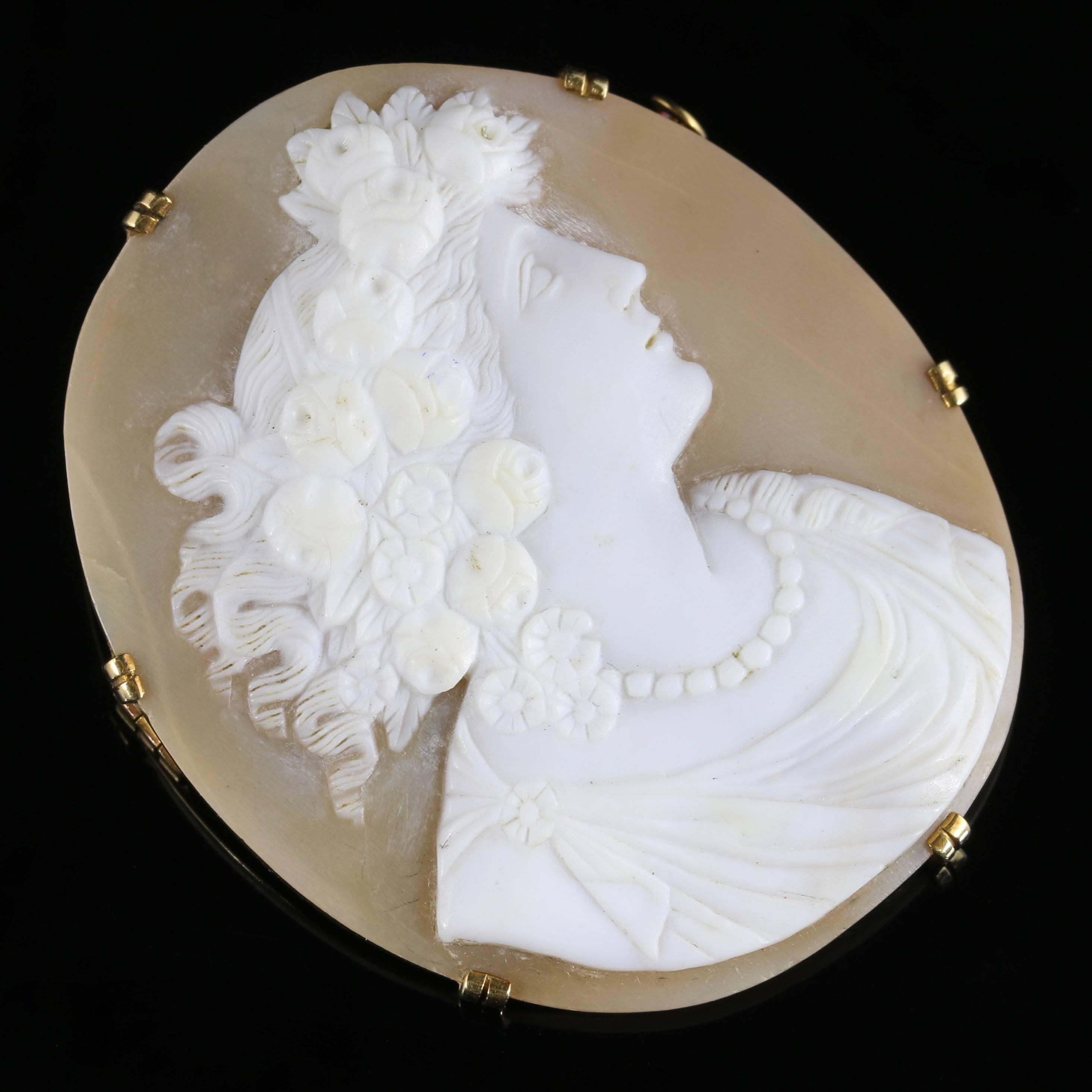 Fore more details please click continue reading down below..

This fabulous French 18ct Gold Victorian cameo brooch is Circa 1880.

A hand carved bull mouth shell cameo which is very well executed portraying a beautiful lady.

Flowers are set into