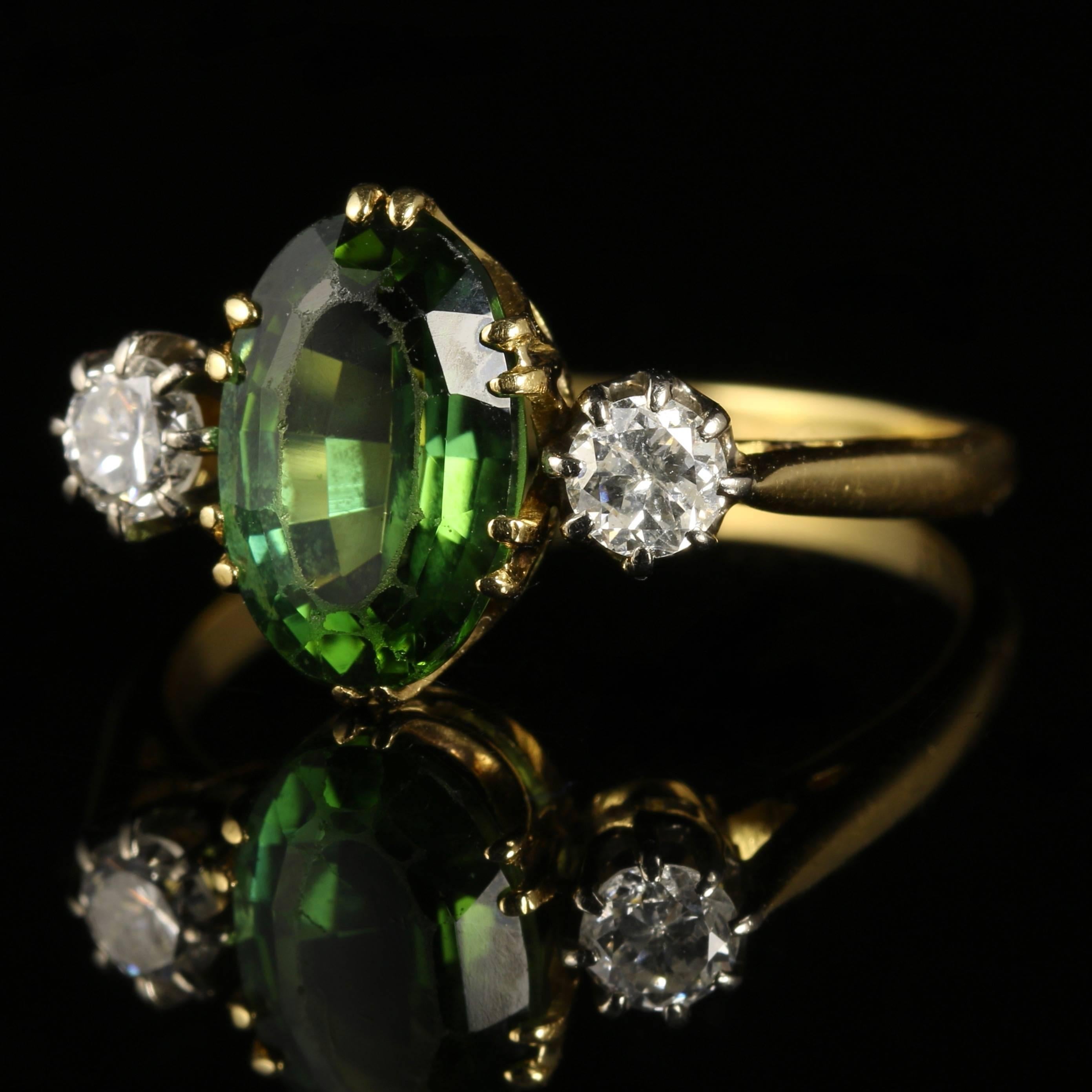 For more details please click continue reading down below..

This fabulous 18ct Yellow Gold Victorian Diamond and Tourmaline trilogy ring is Circa 1900

The ring displays superb quality workmanship from the Victorian period.

The central green