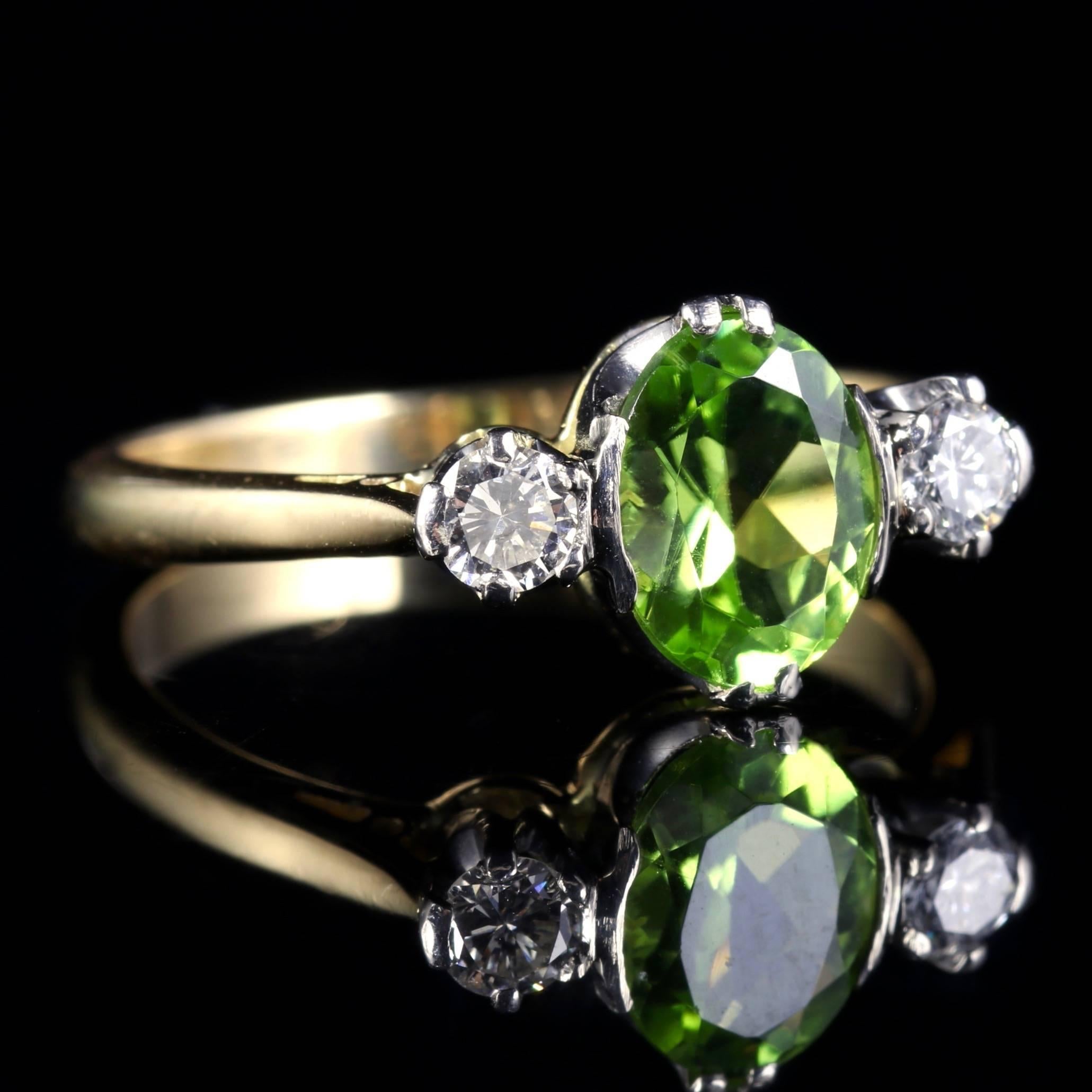 This fabulous 18ct Yellow Gold Victorian Diamond and Peridot trilogy ring is Circa 1900.

The central green Peridot measures 1.50ct with a charming Diamond either side.

The ring displays superb quality workmanship from the Victorian period.

The