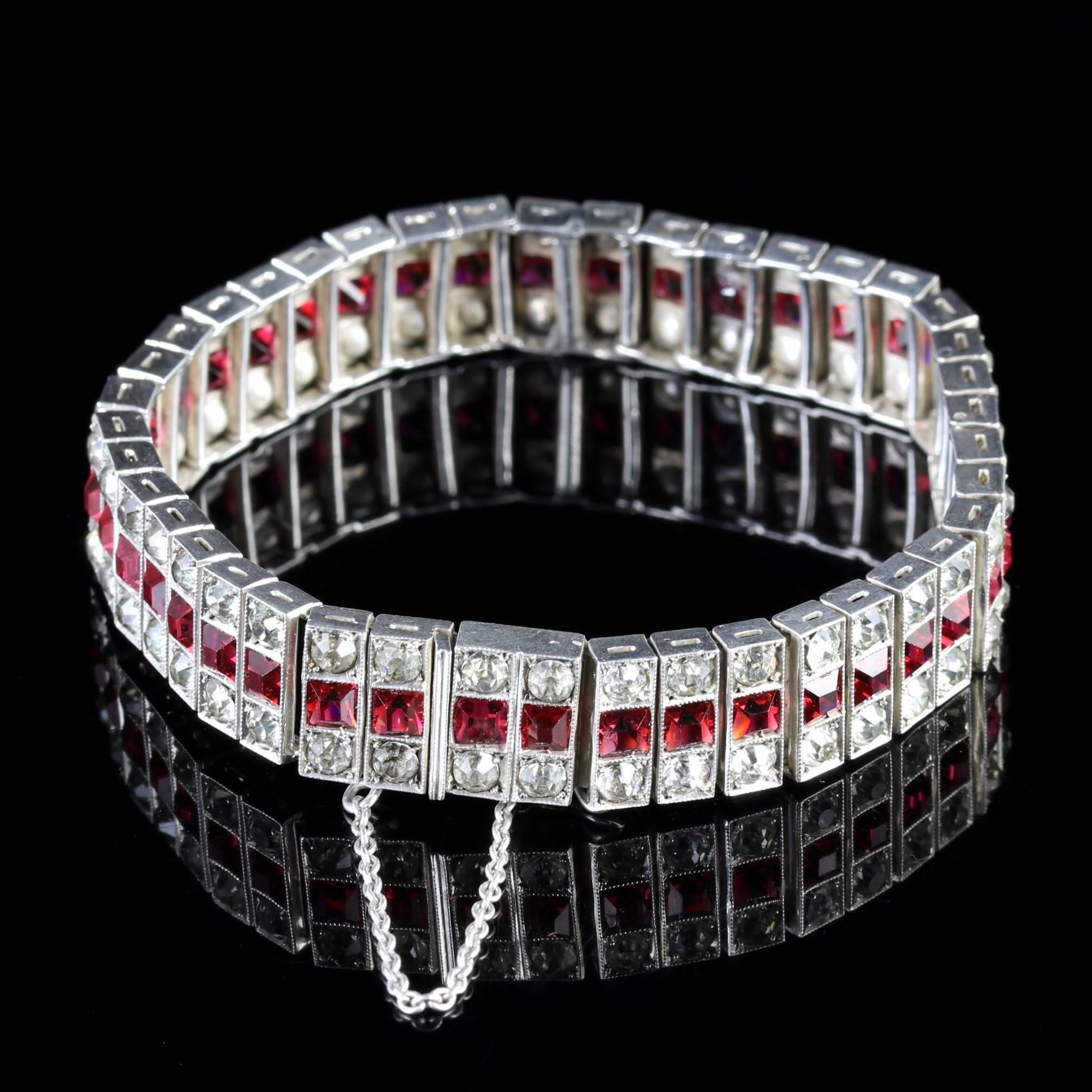 This genuine Sterling Silver Art Deco Ruby Paste bracelet is beautiful, Circa 1920.

Art Deco, named after the 1925 Paris Exposition des Arts Decoratifs et Industriels Modernes, represents the style of the decorative arts popular between the two