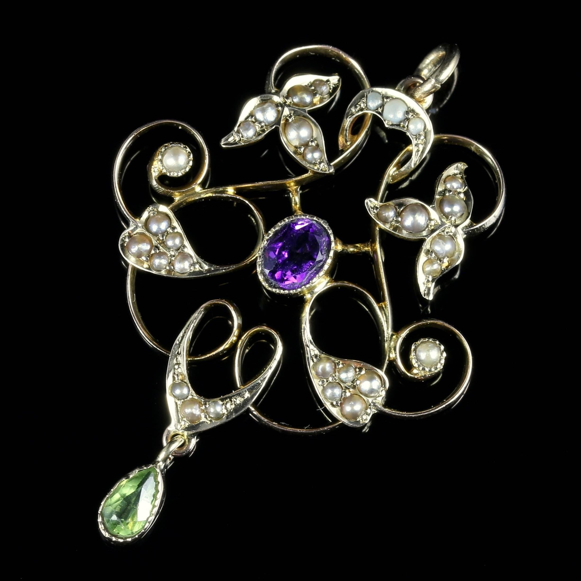 For more details please click continue reading down below...

This fabulous Suffragette Pendant is Circa 1900, set in 9ct Yellow Gold and set with a beautiful central Amethyst, Peridot dropper and adorned with Pearls all around.

All original