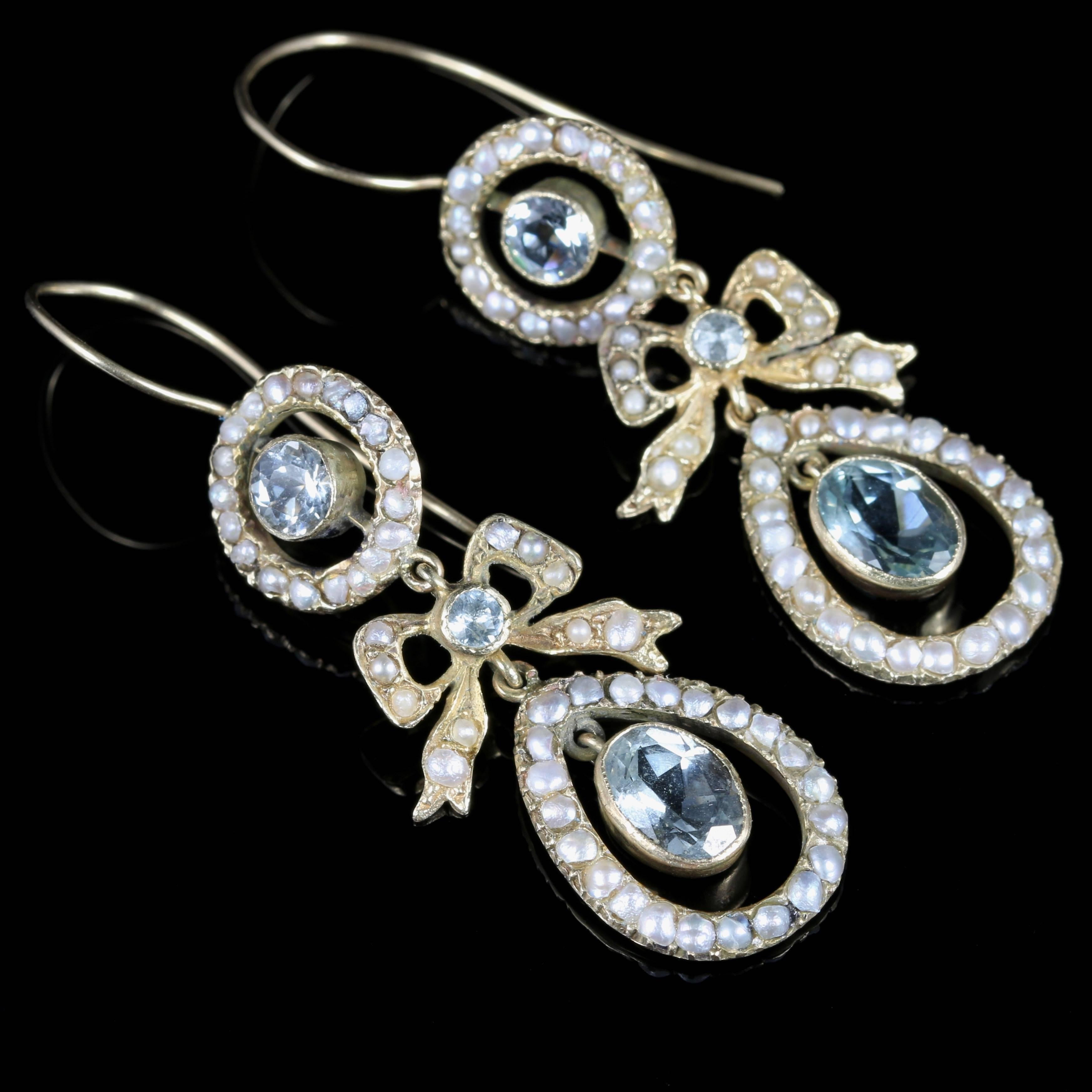 For more details please click continue reading down below...

These spectacular 18ct Yellow Gold long Edwardian earrings are set with lovely ocean blue Aquamarines and creamy Pearls.

A beautiful Aquamarine sits in the top gallery of the earring