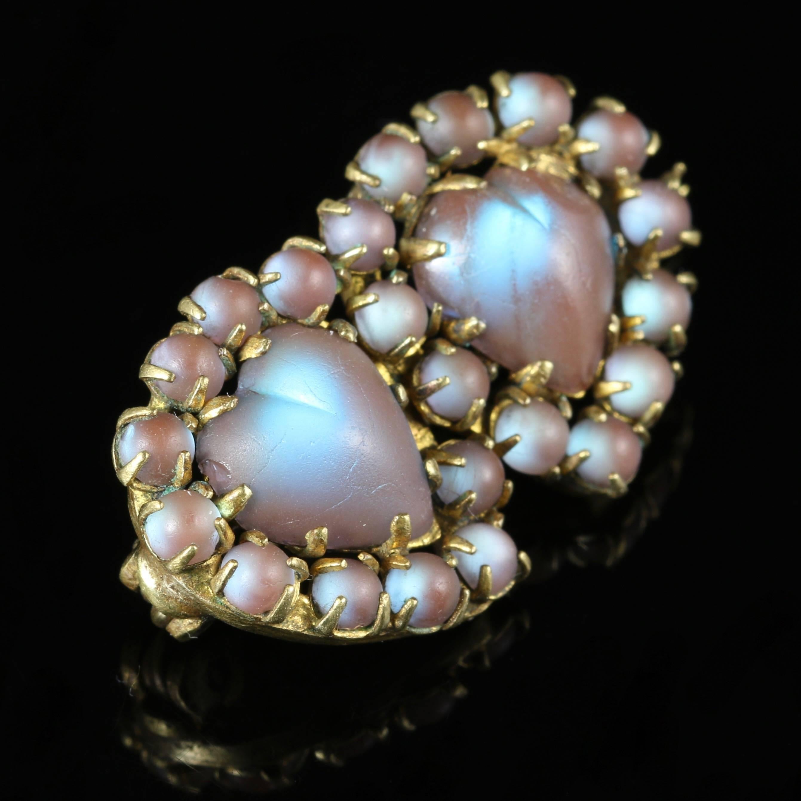 For more details please click continue reading down below...

This lovely Victorian brooch is set with fabulous Saphiret stones.

Circa 1900

The brooch is a lovely double heart made of Saphiret stones.

The colours in the stones are stunning,