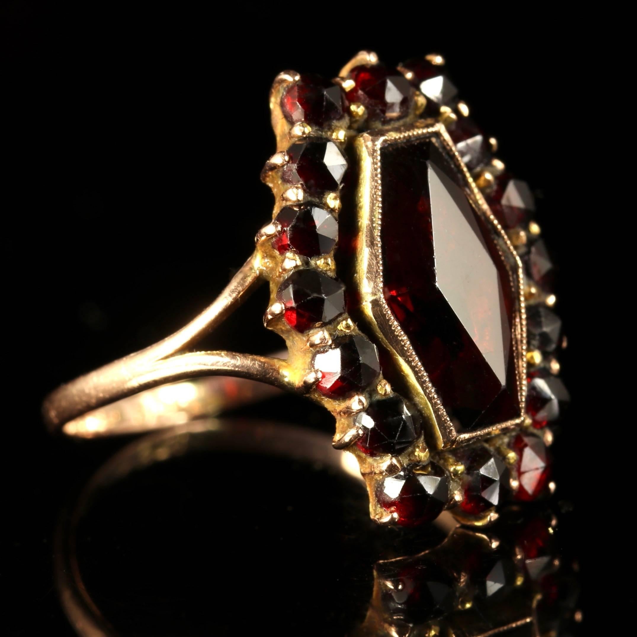 This marvellous Victorian 9ct Gold Bohemian Garnet ring is Circa 1900.

The stunning ring is adorned with a cluster of deep red Bohemian Garnets with a large Garnet in the centre.

Garnet’s are a stone of purity and truth as well as a symbol of love