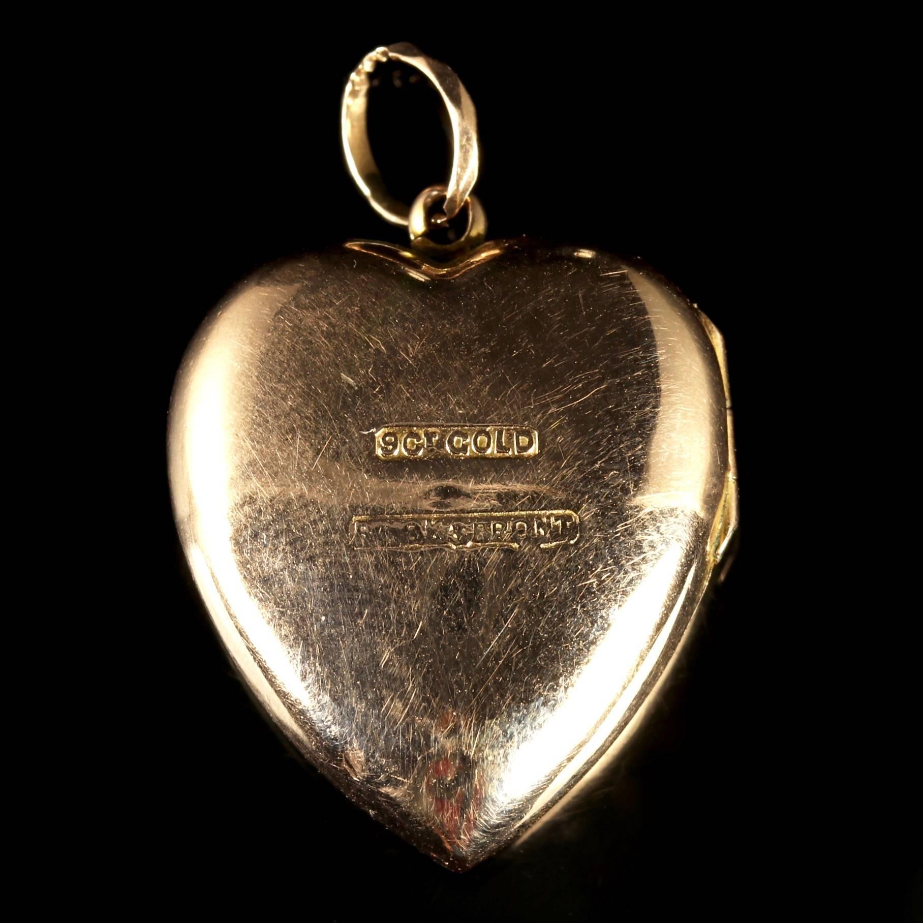 This fabulous Victorian 9ct Yellow Gold heart locket is Circa 1900.

Set with a central Ruby which is surrounded by Paste Stones in a flower gallery.

The lovely locket will hold two images so you can create your own history.

The Ruby is considered