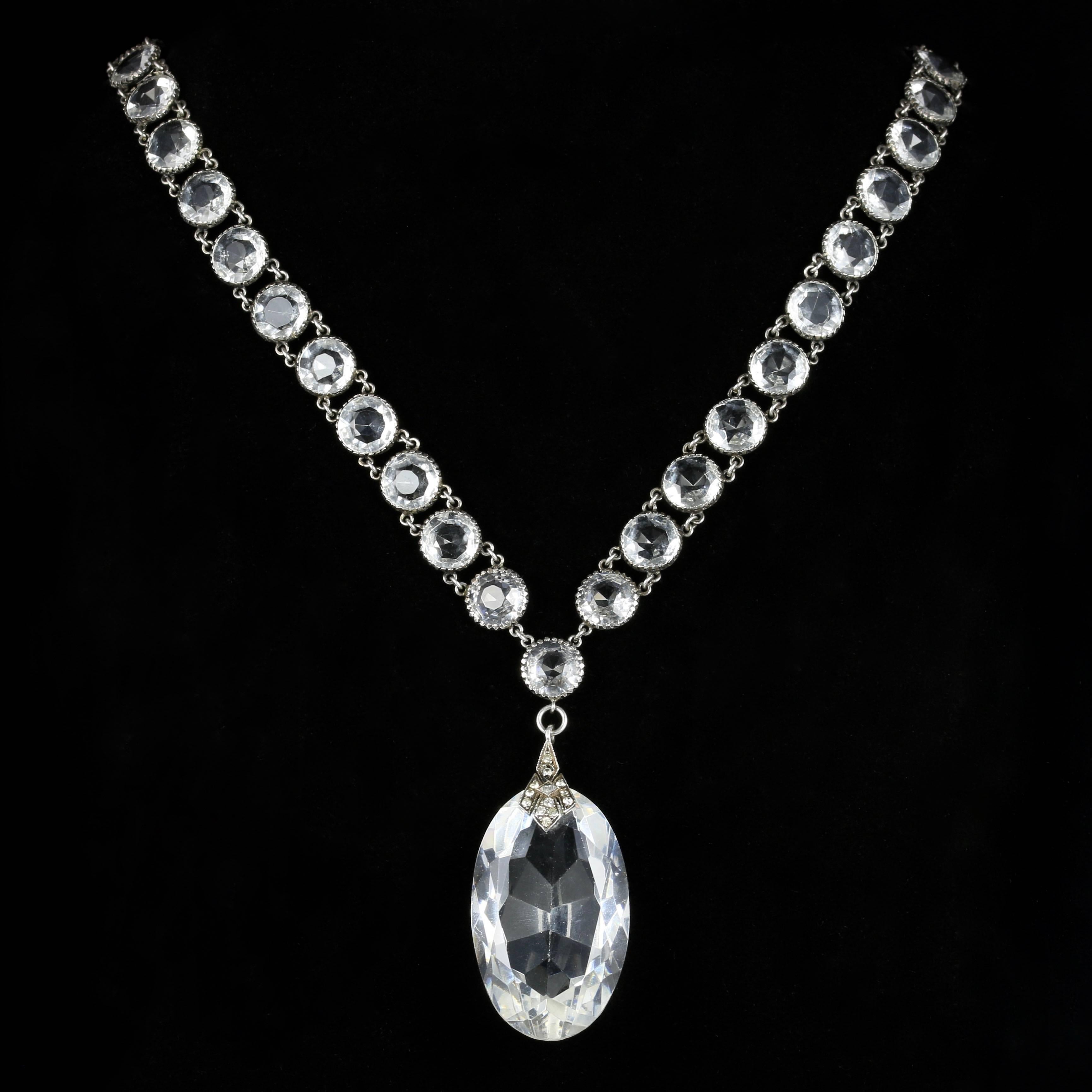 For more details please click continue reading down below...

This magnificent French long Rock Crystal necklace is set in Silver.

Genuine Edwardian Circa 1910.

The beautiful necklace is adorned with a large Rock Crystal pendant with many facets