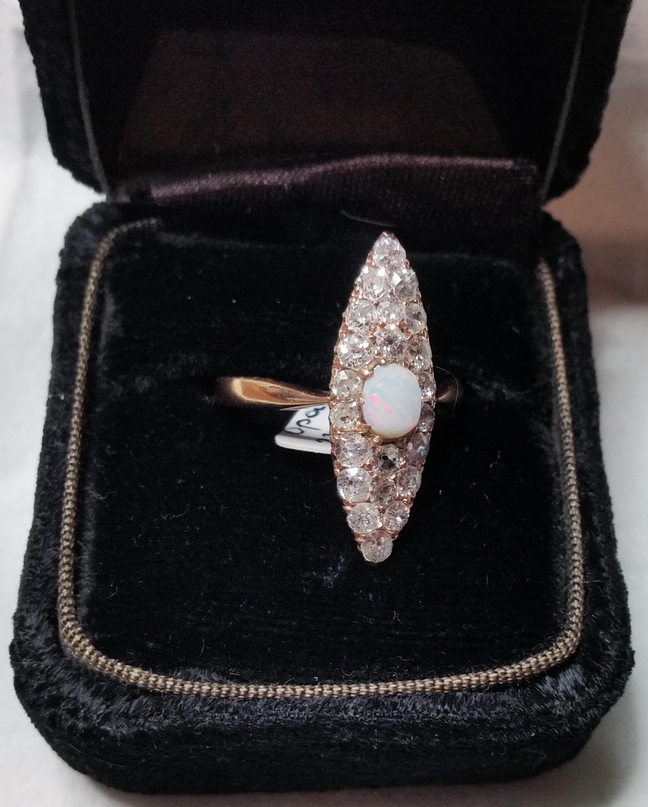 Golden Art Nouveau Ring of most elegant appearance with many diamonds and gemstone (= opal) in middle area:   
ROSE GOLD  (14 ct  /  585)  /  DIAMONDS  (VINTAGE CUTS  / 1.5 Carat)   
Art Nouveau ring of finest quality: 
This ring covered with many