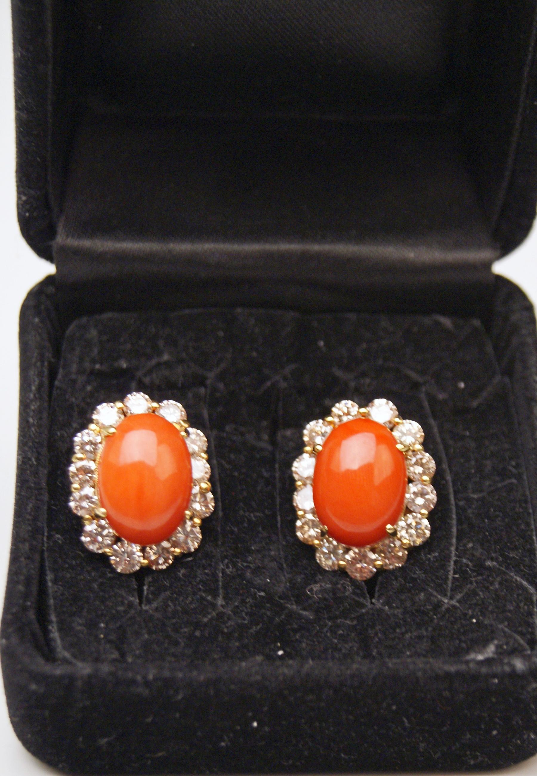 Stunning Viennese Pair of Golden Cluster Earrings:
There is a large oval coral attached to middle area of each earring / the coral is surrounded by a superb ring consisting of finest diamonds having weight of FOUR CARATS IN TOTAL.  These earrings