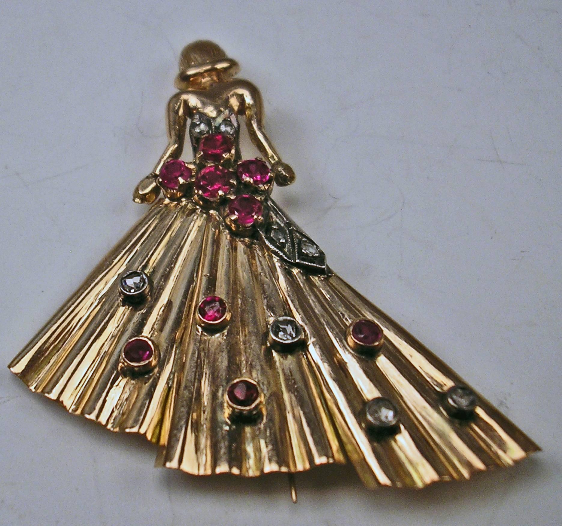 Finest golden brooch rarely shaped: LADY CLAD IN DINNER DRESS,
covered with various diamonds as well as with almandines.

GOLD  (14 CARAT GOLD / 585) - checked
Vienna, made circa 1925

Total height:  5.1 cm    2.00 inches

SHIPPING FEES:  
