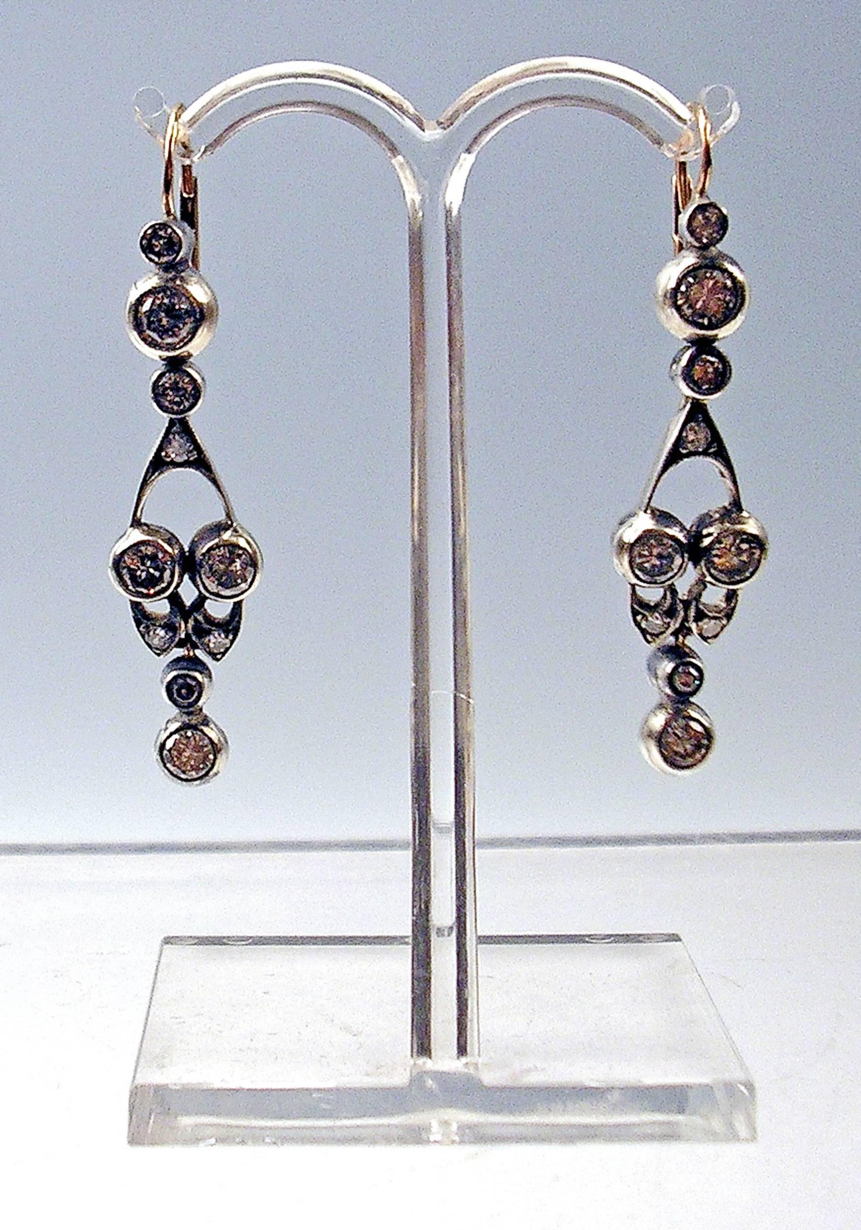 Stunning Art Nouveau Golden Earrings with Diamonds  (vintage cut). 

GOLD  (14 CARAT GOLD / 585) +  DIAMONDS  (1.30 ct)

The Parts of Earrings are movable.

Total length:  4.5 cm     1.77  inches

Hallmarked:
Austrian Official Punch   
(
