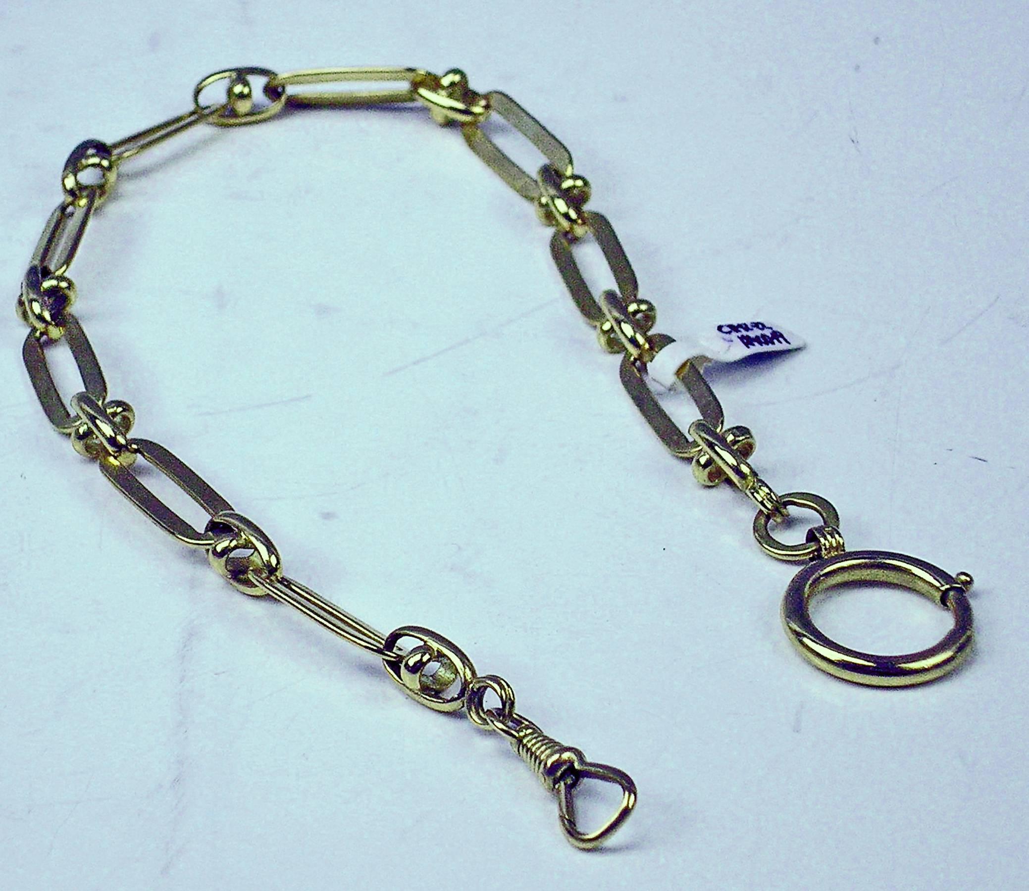 Most elegant golden chain of pocket watch.

GOLD  (14 CARAT GOLD / 585) 

Skipping ring and spring hook ( = carabiner ) existing.

Total length:  34.5 cm     13.58  inches

Hallmarked:
Austrian Official Punch   
( so-said Fuchskopfpunze  