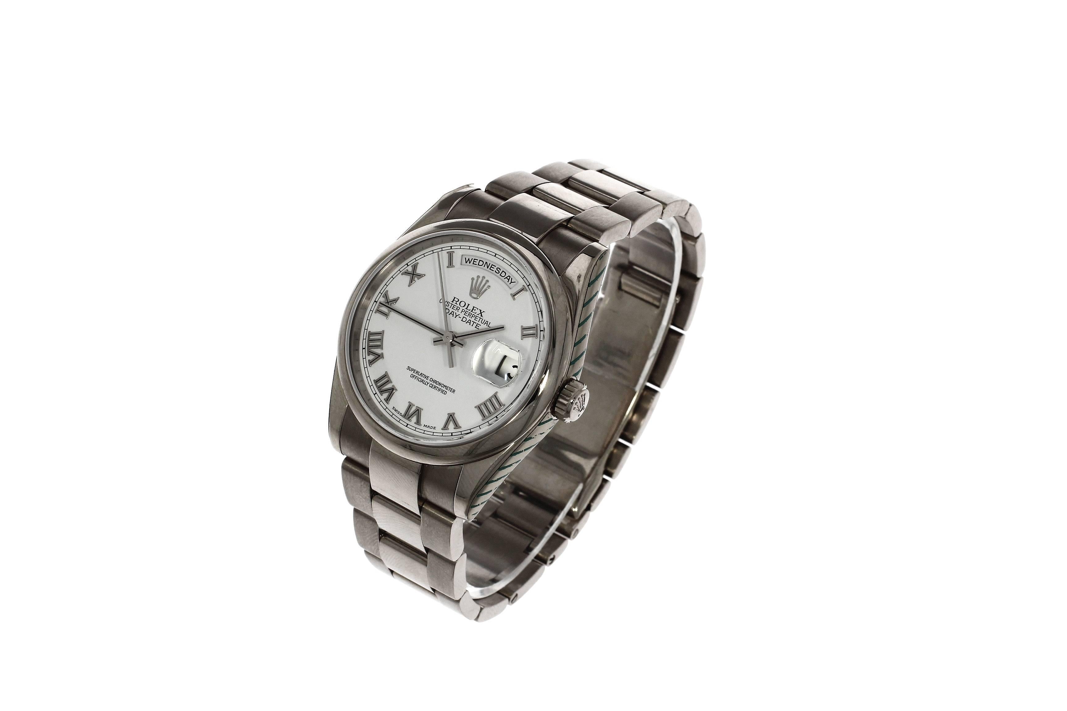This pre-owned Rolex Day Date 118209, It has a 36mm 18K White Gold case. Fitted with a white roman numeral dial. A signed Rolex oyster 18k bracelet. With an automatic movement. Circa 2002, the case has a serial reading: Y280XXX

The Rolex Day-Date