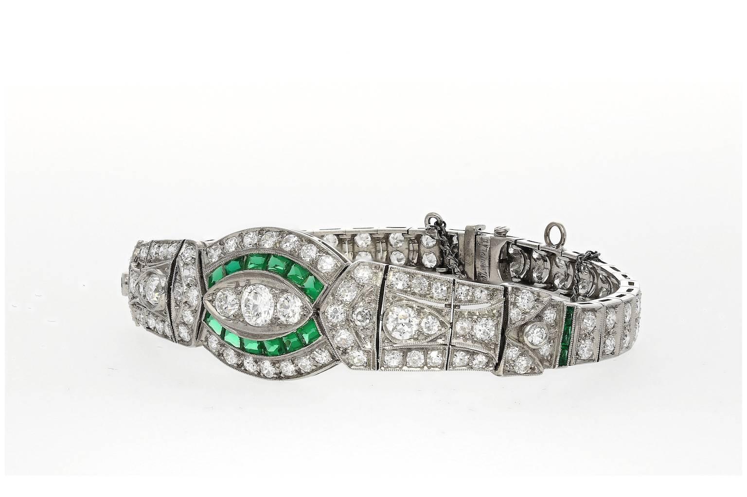 Set in Platinum.

Composed of 119 Round-Brilliant cut Diamonds and 18 Tapered-cut natural Emeralds.

Approximately 10 carats Diamonds and 0.50 carat Emeralds.