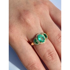 1.25 Carat Oval Colombian Emerald & Diamond Halo Three Stone Ring