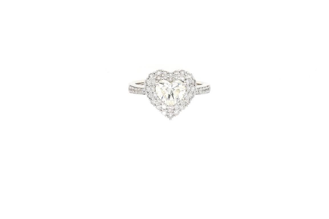 GIA Certified: J Color,  VS2 Clarity.

Set in 4.98g of 18k White Gold.
Accented by 0.66ct of round-cut diamonds.
