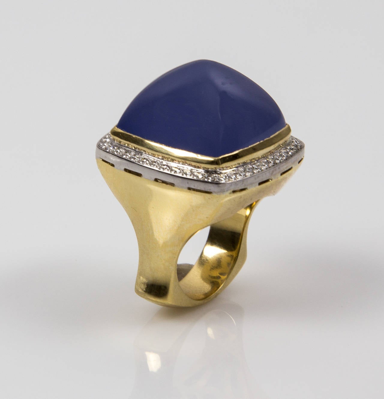 Magnificent Classic Dress Ring, centering a large 39.02 carat Sugarloaf cabochon-cut Blue Chalcedony, surrounded by 48 round brilliant-cut diamonds with an approx total weight of 0.48ct; artistically hand crafted in 18k yellow and white gold; Ring