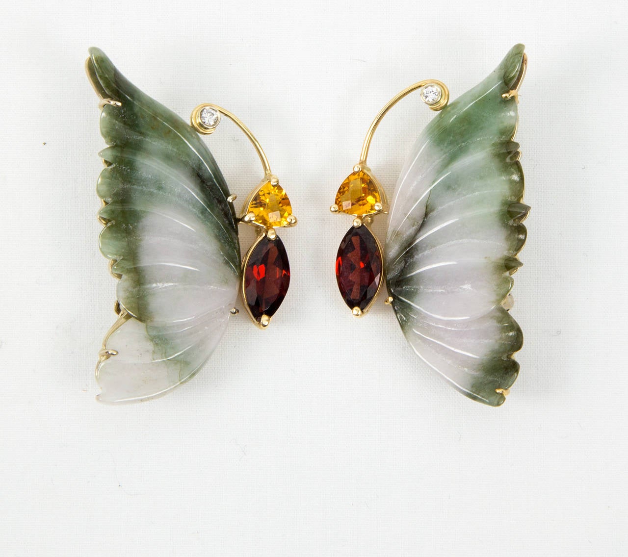 Simply Beautiful pair of Moss Green Jade, Garnet, Citrine and Diamond Flying Butterfly Brooches. Featuring fabulous hand carved Jade Wings. Hand crafted in 14k yellow Gold. Each pin measures approx. 1.75 