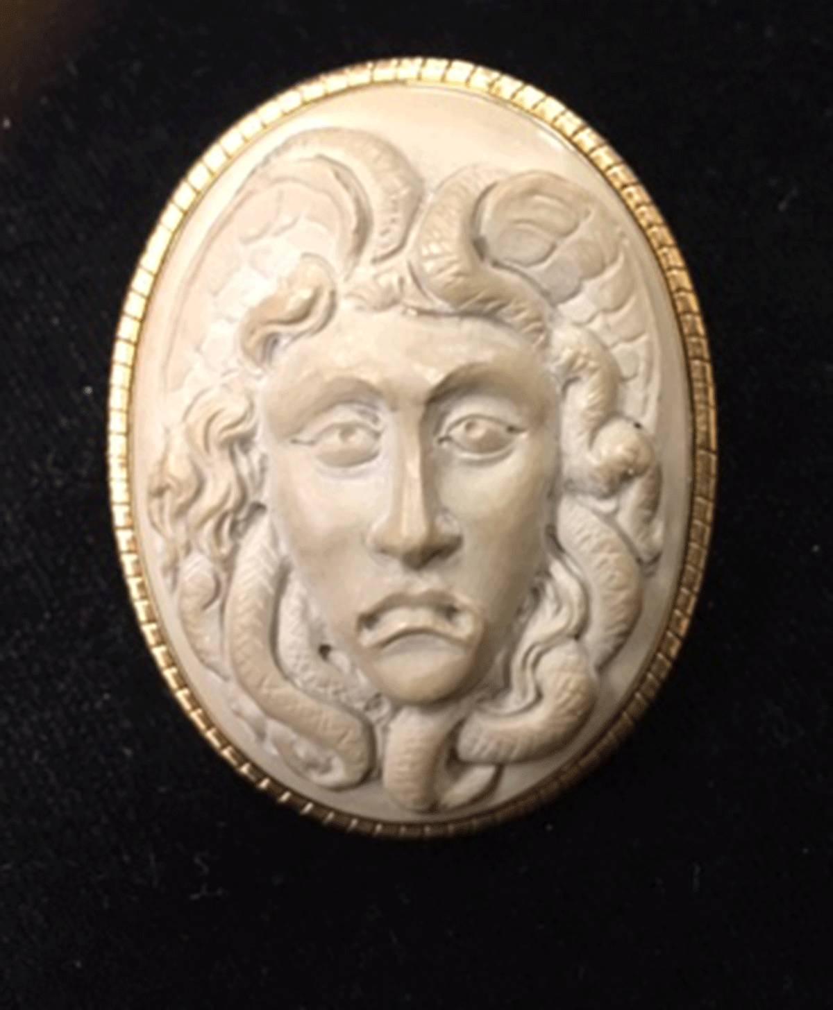 Victorian Lava Cameo Brooch Pendant of Medusa; Beautifully Hand Carved in High Relief ; surround in Solid 18K Gold; surround marked: 750. Approx. size 1.75" x 1.5"; c.1850-1900.  Classic and Timeless...A must have you'll enjoy for many