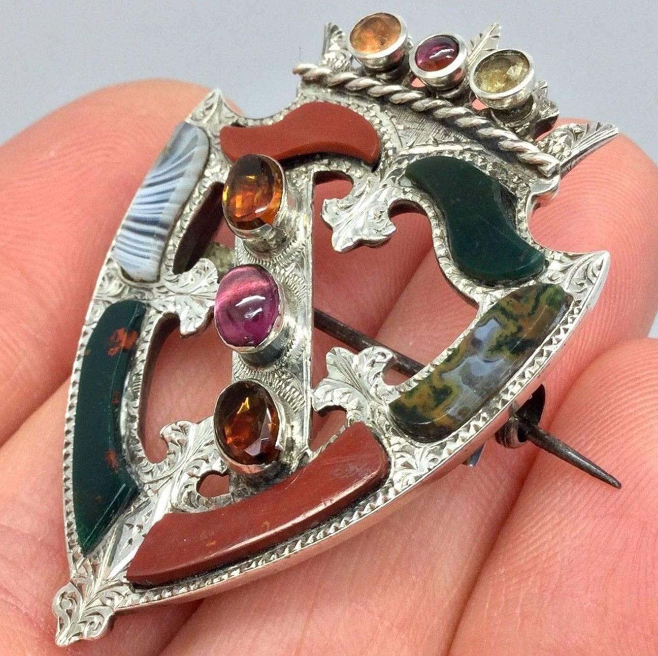 Beautiful quality large Antique sterling silver Scottish agate brooch, made famous by professor McGonagall in the Harry Potter films where she wore one very similar The agates are separated with finely engraved silver and surrounded by exquisitely